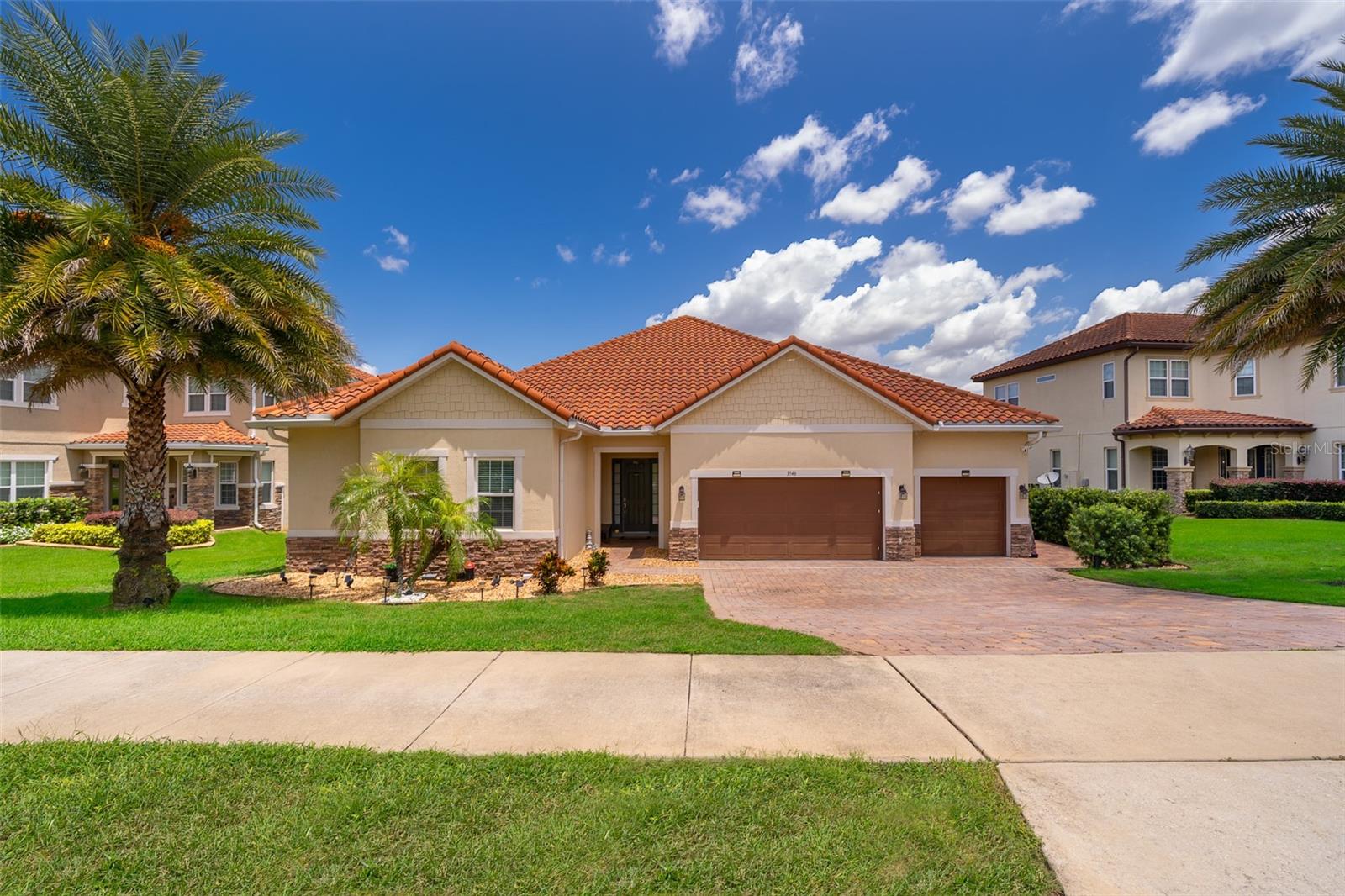 Welcome to Lakeside Luxury Living!
This stunning lake-view home in Bella Lago offers nearly 4,000 square feet of elegant living space, featuring 4-bedrooms, 3.5-bathrooms, a 3-car garage, and a host of high-end upgrades. From the tile roof to the Tuscan-style paved driveway, every detail of this property is thoughtfully designed for style and comfort.
Step through the grand entrance into a bright and spacious foyer. To the left, double doors open into a formal dining room—perfect for hosting dinner parties. Continue into the open concept living area, where you'll find an elegant kitchen with tall cabinetry, granite countertops, and a large center island ideal for both casual dining and entertaining. A butler's pantry connects the kitchen to the dining room for added convenience.
Just off the kitchen, a charming dinette area leads through French doors to the screened-in lanai—your personal outdoor retreat. Enjoy al fresco dining with breathtaking views of Lake Felter.
The primary suite offers a private sanctuary with his-and-her walk-in closets and a spa-like en suite bath. The Jack-and-Jill suite at the front of the home is perfect for privacy.
Upstairs, a massive bonus room loft with a full bath and wet bar plumbing provides the perfect flex space for a game room, home theater, or guest suite.
Additional features include: Ceramic tile floors throughout main living areas,Wrought iron staircase, Spacious laundry room, Plumbed for gas grill, 3-car garage and above ground hot tub that seats 6.
Community amenities include a private playground, lakefront gazebo, and dock access to Lake Felter. Just minutes away, residents can indulge in excellent shopping opportunities, dine at a variety of luxury and casual eateries, and explore nearby theme parks for entertainment. The neighborhood benefits from proximity to brand-new, state-of-the-art hospitals and a top notch school system, providing peace of mind for residents seeking quality healthcare services and high end education. Whether it's shopping, dining or entertainment this vibrant community offers an abundance of options to suit every lifestyle. Don't miss the chance to own this beautifully styled home with serene lake views—schedule your private showing today!