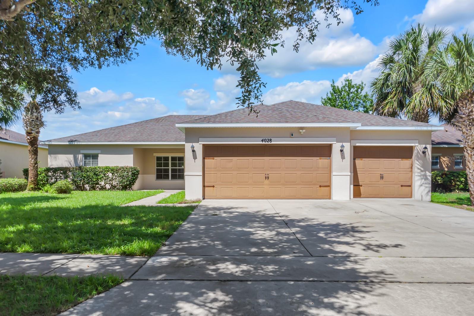 Welcome HOME to this 4 bedroom, 2.5 bathroom property one floor with a bonus Office space, plus a 3-Car Garage home nestled in the Gated community of Bella Pointe! Recent upgrades of the home include new painting, New Ac (2024). This home grabs your attention with character and curb appeal from the moment you arrive complimented by lush landscaping, and an oversized driveway. As you step inside, you are greeted with a spacious open concept floor with natural lighting, living in style fully equipped with Stainless Steel appliances, Granite countertops, shaker style cabinetry, large basin sink, built in desk, and breakfast bar for added convenience. You’ll find the spacious primary bedroom with a MASSIVE Walk-In Closet, separate sinks, framed glass shower, and private water closet. Nearby you’ll find three additional bedrooms and a guest bathroom with dual sinks and a shower with tub. As you step outside to your oversized fully FENCED in backyard ready for you to create your own paradise oasis with plenty of space for a pool. Bellalago community boasts many activities for the active family to stay entertained including a clubhouse and resort style pool, a fitness center, basketball, volleyball, and tennis courts, walking and biking trails, dog parks, community boat ramp and fishing pier, yoga instructors, and the community's own restaurant - Flip Flops Bar & Grille. With 2 gate entrances for easy access to Pleasant Hill and to Poinciana, you’re just minutes from Valencia College, SunRail, interstate and other main roads. Also close access to plenty of shopping, dining, hospitals/clinics, golf courses, a short 15-minute drive to Old-Town Kissimmee, 25 minutes to Disney and attractions, 30 minutes to Orlando International Airport, and 30 minutes to Downtown Orlando. NO CDD and a LOW HOA, this home is ready for you to call Home! Upgrade both your living and your lifestyle and schedule your private showing Today!!