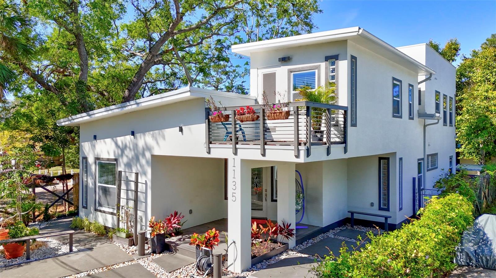Discover a rare gem in the heart of downtown Sarasota, an architectural masterpiece blending modern industrial style with luxurious comfort. If one is looking for a standard cookie cutter model home, this property is not for you. If a more creative, well built eclectic and stylish modern industrial masterpiece is more up your alley, then THIS is the home you need to see. This property has been completely rebuilt from its original purchase that its essentially a new construction 2024 home. This striking 4-bedroom, 3-bathroom home boasts 15' ceilings, expansive windows, and an open-concept design that exudes sophistication. Exposed wooden beams, LFT floors (Large Format Tiles - ceramic), and designer architectural finishes create a contemporary aesthetic, while the gourmet kitchen, outfitted with high-end appliances and sleek quartz countertops, is a chef’s dream. Polished electrical conduits and AC ductwork has been purposefully exposed to add to the industrial feel. A large Big Air fan graces the Livingroom ceilings, while the kitchen and the large screened gazebo enjoys the other two oversized units. The primary suite offers a private retreat with a spa-like ensuite and custom walk-in closet. A true entertainer’s paradise, the home features a full rooftop deck, offering breathtaking skyline views, perfect for sunset cocktails or stargazing. The backyard is equally impressive, featuring a private four-hole golf course, designed for both casual play and serious practice, along with a huge fully covered and screened in gazebo (with large television) for effortless indoor-outdoor living, staying dry from any sprinkles. Large, clean and well built shed sits in the back right corner of the tropical paradise and can be used for an office, gym, storage or even an adu (additional dwelling unit) A lot of possibilities here for additional income via rentals. Situated in the coveted Central Cocoanut district, this home is mere minutes from Sarasota’s world-class dining, arts scene, and cultural hotspots. Walk or bike to the bayfront, farmers’ market, and eclectic boutiques of Main Street, or take a short drive to the powdery sands of Lido Key Beach and the charm of St. Armands Circle. Enjoy an effortless lifestyle with proximity to renowned theaters, waterfront parks, and year-round festivals that make Sarasota one of Florida’s most dynamic coastal cities. Whether you’re perfecting your short game at home, hosting unforgettable rooftop gatherings, or exploring the best of downtown, this modern sanctuary offers an unparalleled blend of luxury and location.