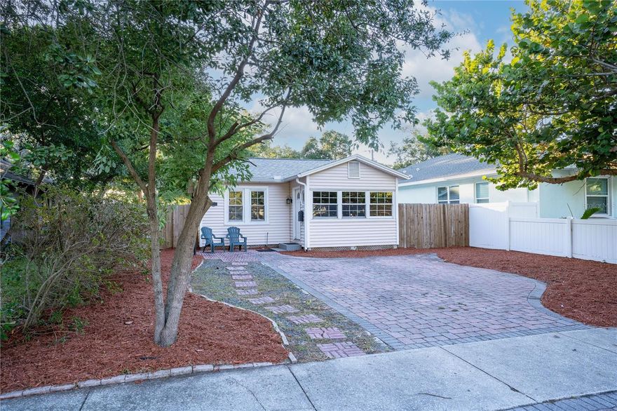 Nestled in the heart of St. Petersburg, this charming, updated 1-bedroom, 1-bathroom home is a hidden gem on an oversized lot. As you arrive, you're greeted by a pavered driveway and fresh landscaping that sets the tone for what's inside. Step through the front door, and you'll be awed by the abundance of natural light pouring in through a wall of windows, framed by warm wood accents – a perfect space for an inspiring office or a cozy sitting room. The living room boasts elegant picture frame moldings on the walls and flows seamlessly into the eat-in kitchen, which features custom maple cabinets with a wine rack and pantry, elegant granite counters, and a coffered ceiling. This kitchen also has room for a table and two chairs, creating the perfect spot for morning coffee or intimate dinners. The bedroom is generously sized and boasts numerous windows, ensuring plenty of natural light and a welcoming ambiance. The bathroom offers practicality with a single vanity, low-flow toilet, and a convenient walk-in shower. For added convenience, there's an inside utility room, ready for your washer and dryer. Outside, the possibilities are endless with a vast fenced backyard and alley access, making it ideal for your unique vision. A storage shed is there to accommodate your extra needs. This wonderful home is situated in a thriving neighborhood, surrounded by lots of new construction. Located just down the street from Kiwanis Park, it offers easy access to I-275 and is close to shops, restaurants, and all the cultural treasures downtown St. Pete has to offer. Don't miss this opportunity to make this home your own and enjoy the vibrant St. Petersburg lifestyle!
