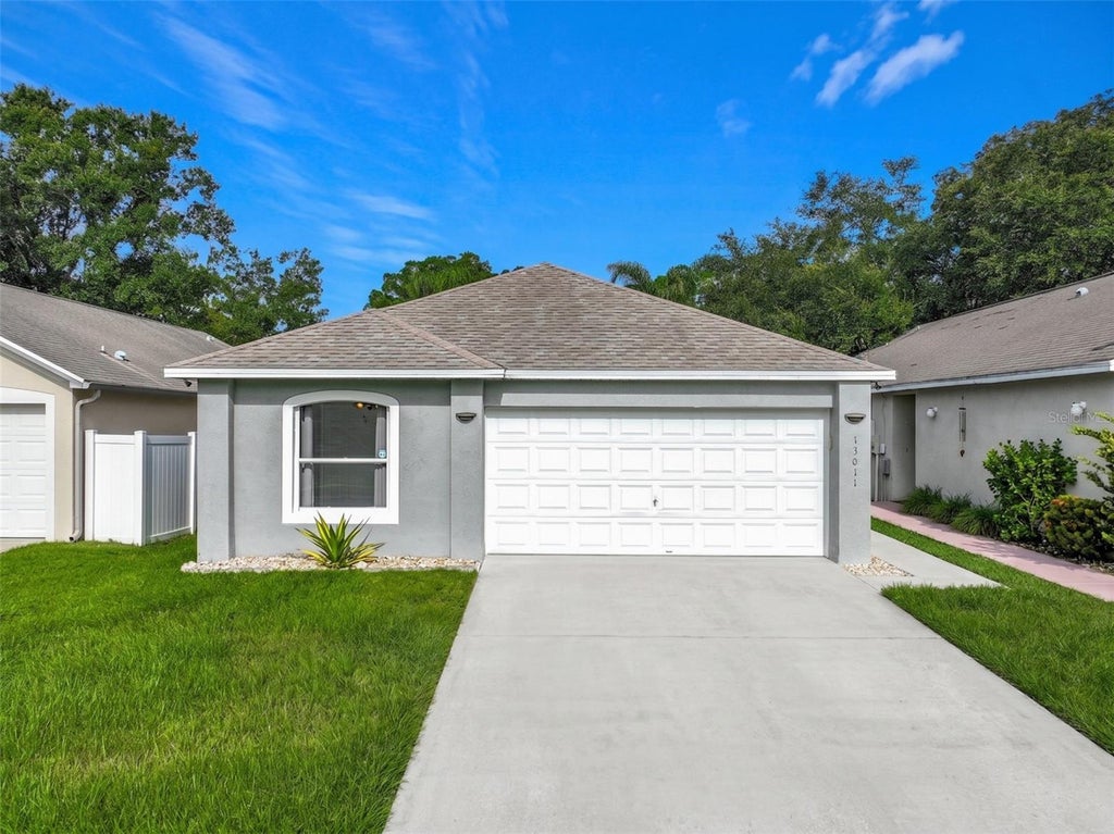 Photo of 13011 Odyssey Lake Way, Orlando, FL 32826 (MLS # O6423710)