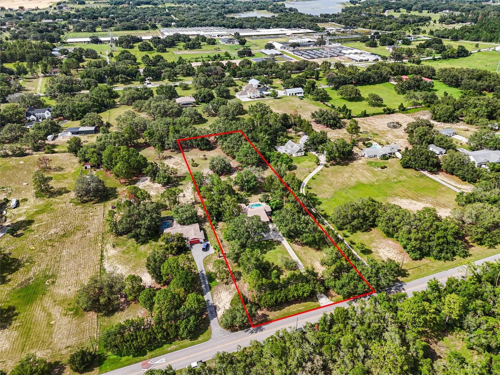 RARE Winter Garden Opportunity — Over 2.5 Acres! Welcome to your own private retreat on 2.57 high-and-dry acres in the heart of Winter Garden's most exciting growth corridor. Whether you're envisioning a peaceful country lifestyle or planning your next luxury estate, this property offers endless opportunities. With agriculture zoning, you have the freedom to build your custom dream home, create a nursery, hobby farm, establish a small agricultural business, or simply enjoy wide-open space and privacy. Nestled behind a private gate and framed by a breathtaking canopy of mature trees, the entrance opens to a driveway leading to the current home, completely surrounded by lush, usable land. The single-story home, built in 1982, is 2,500 sq ft and has 3 bedrooms, 2 full bathrooms, and a custom pool. The home is functional and well-maintained by the current owners. Enjoy peaceful evenings under the stars in your own slice of paradise. Located just minutes from Hamlin Town Center, Horizon West, and a short drive to Disney, this is a rare blend of rural serenity and suburban convenience.