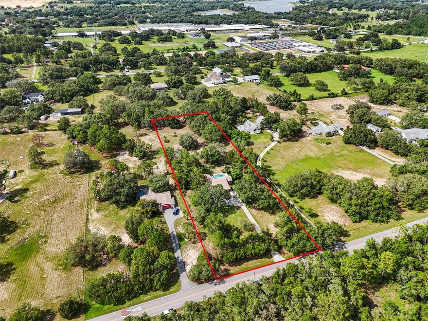 Previous buyer financing fell through. RARE Winter Garden Opportunity — Over 2.5 Acres! Welcome to your own private retreat on 2.57 high-and-dry acres in the heart of Winter Garden's most exciting growth corridor. Whether you're envisioning a peaceful country lifestyle or planning your next luxury estate, this property offers endless opportunities. With agriculture zoning, you have the freedom to build your custom dream home,  create a nursery, hobby farm, establish a small agricultural business, or simply enjoy wide-open space and privacy. Nestled behind a private gate and framed by a breathtaking canopy of mature trees, the entrance opens to a driveway leading to the current home, completely surrounded by lush, usable land. The single-story home, built in 1982, is 2,500 sq ft and has 3 bedrooms, 2 full bathrooms, and a custom pool. The home is functional and well-maintained by the current owners. Enjoy peaceful evenings under the stars in your own slice of paradise. Located just minutes from Hamlin Town Center, Horizon West, and a short drive to Disney, this is a rare blend of rural serenity and suburban convenience.
