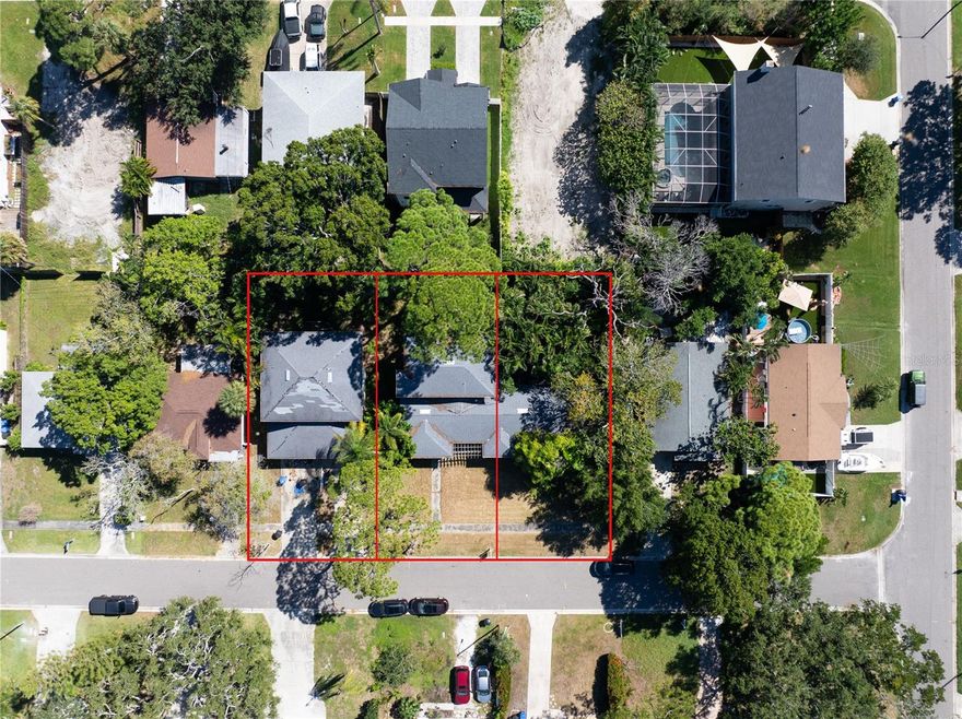 Let's talk potential! Rare opportunity to acquire 3 lots or leave it as is and build a dream home. 151' wide and have applied for the buildable lot letter to divide. Currently has a single family residence on 100' and a detached double car garage with apartment above on the other 51'. The large 2 story home was affected by flooding from Helene on the ground floor. Desirable Shore Acres neighborhood close to everything St. Petersburg has to offer. Shopping, downtown, and the World Renowned St. Petersburg Beaches are all within a 30 minute drive. Super fun Golf Cart Community with parades and the amazing Shore Acres Rec Center with pool, dog obedience training, Yoga and more.