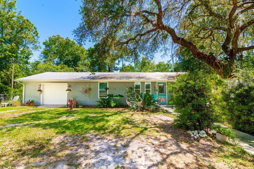 This picturesque, 5 acre homestead with two private lakes offers quiet country living close to everything New Smyrna Beach has to offer.  This unique property straddles both sides of South Samsula Drive. The East side features a charming, remodeled 2 bedroom 2 bath home nestled amongst a lush Florida garden, overlooking a small, idyllic lake.  The spacious family room is light and bright with cathedral ceilings and updated windows to take in the peaceful surroundings.  Sliders open to a private deck with access to the sprawling lawn, full of flowering tropical plants and an Orchid house with a hot/cold outdoor shower.  Fruit trees frame the yard, including pomegranate, pecan, red navel, kumquat, tangelo, lemon, guava, red grapefruit and juice orange.  There’s an attached 1 car garage and a huge, detached metal carport that can easily accommodate 4 cars or trucks.  Across the road, the west side of the property truly needs to be seen to be appreciated.  This beautiful, park like parcel is a throwback to the best of Old Florida, highlighted by a large, beautiful lake stocked with bass and teeming with wildlife.  Enjoy fishing from the private dock and lounging on the porch swing.  Keep your gear in the small fishing storage cabin.  Launch a Jon boat or kayak and take in the natural beauty from the established ATV trails.   The property is framed by two stately groves of mature cedar trees surrounding an open field ideal for picnics and grilling, vegetable gardening, playing ball and parking all the boats and toys you desire.  Updates to the home include stove with induction range 2021, refrigerator 2020, roof 2015, HVAC 2013-2014, water heater 2013, septic and drain-field 2015, water softener 2016, many of the windows 2016.