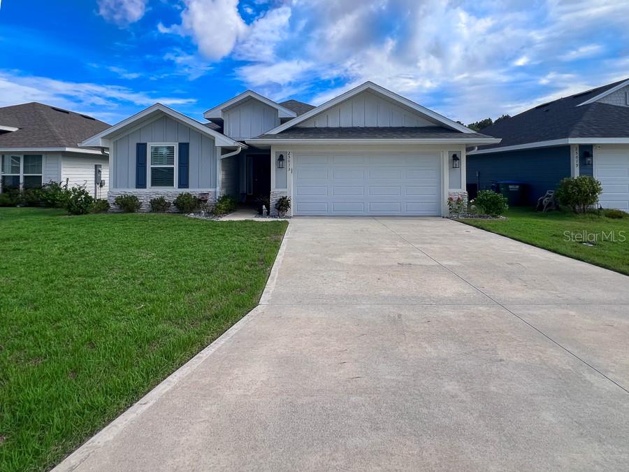 Modern Living Meets Small-Town Charm. No detail was overlooked in this stunning 4-bedroom, 2-bath home nestled in the Country Way South subdivision, just minutes from the heart of Newberry. Built in 2023, this thoughtfully designed home offers over 1,700 sq ft of stylish, functional living space. Step inside to find luxury plank–style tile flooring, plush carpeted bedrooms, granite countertops, stainless steel appliances, modern fixtures, and upgraded cabinetry. Additional touches include LED lighting, plantation shutters, brushed nickel faucets, and much more. The open-concept layout is perfect for both daily living and entertaining. The kitchen is open to the dining and living areas, while a welcoming foyer leads to two guest bedrooms and a full bath. The primary suite is a true retreat, featuring a walk-in closet, dedicated shoe closet, and a luxurious en suite with dual sinks, granite vanity, walk-in shower, and linen closet. Enjoy Florida living year-round on the covered lanai, overlooking peaceful natural surroundings. The home also includes a laundry room with washer and dryer, and a two-car garage. Located just 20 minutes from Gainesville and within top-rated school zones, you’ll love the perfect blend of modern comfort and small-town atmosphere — with shopping, dining, and entertainment just around the corner. Lawn care included. Owner will also 1 small pet with non-refundable pet fee!
-$60 Application Fee per person (over 18)
-$60 Guarantor Fee (if applicable)
-$250 Leasing Fee (due at lease signing)
-Security deposit equal to one month rent!
- Renter's insurance required!
