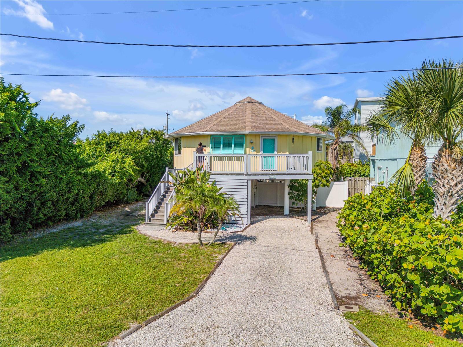 Charming 2-bedroom, 2-bath home in the desirable Bethune Beach community, just steps from the non-driving beach and the Indian River Lagoon. This elevated residence offers a coastal lifestyle with solid surface counters and outdoor features including a deck, balcony, and outdoor shower. Conveniently located near Bethune Beach Park with tennis, pickleball, and a fishing pier, plus local favorite JB’s Fish Camp for waterfront dining and kayaking. Just minutes to Canaveral National Seashore and a short drive to Flagler Avenue’s shops and restaurants, this property captures the best of New Smyrna Beach living.