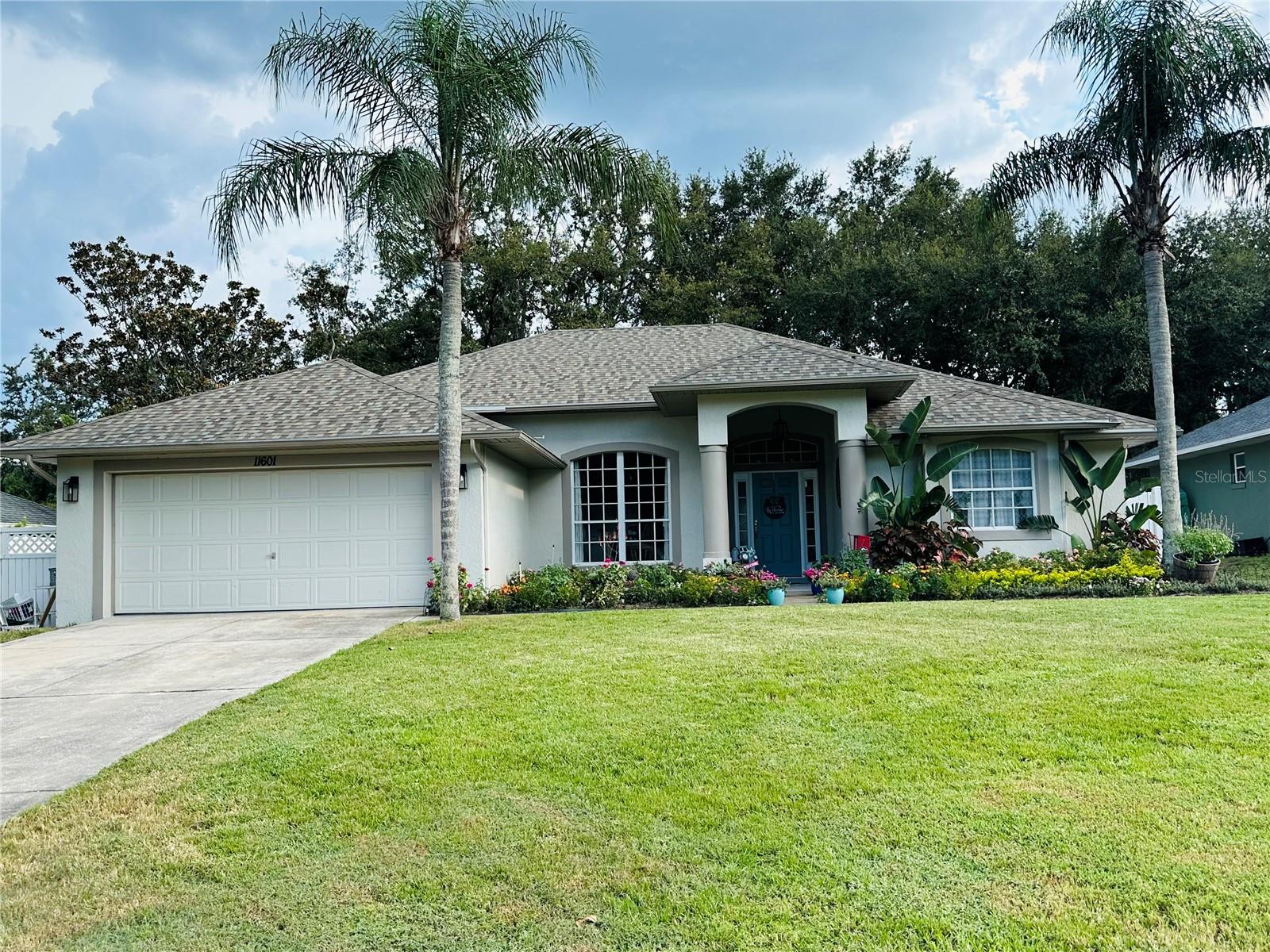 Welcome Home! This gorgeous updated home is looking for new owners. Beautiful open floor plan with all the bells and whistles. This home welcomes you in with a formal Dining area and a home office. See right through the rear slider into the large backyard. The Kitchen/Family Room is perfect for family get-togethers or for watching the big game. Cook a magnificent Thanksgiving Dinner in the double oven and convection stove/microwave. Appliances are stainless steel and the kitchen has new cabinets and gorgeous granite countertops. There is a great breakfast bar and an additional eat-in kitchen area. The home features a split bedroom plan with the Master Bedroom off the Formal Dining Room. This room is a perfect escape after a long day. The Master Bathroom features a soaker tub with a separate shower and separate sink areas so everyone has their own space. The bedroom features double closets, with plenty of storage. The two additional bedrooms are very nice sized and they have roomy closets for storage. But all you need to do is open up the sliders off the Living Room and Family Room and there is an entire covered patio perfect to sit and read a book or have a family BBQ. There is an extra extended screened lanai off the covered patio, so there is plenty of space for larger family gatherings as well. Have a boat? The side yard features a concrete slab where you can store your boat, trailer, Seadoos, etc. Even with all of this, there is still a huge backyard with a beautiful paver patio area...the perfect spot for a fire pit. The current owners currently have part of the yard sectioned off for their animals, so this could be a great dog run and the yard is fully fenced. All light fixtures and fans are new and there is beautiful Luxury Vinyl Plank flooring through the majority of the home. The home has a new roof, newer A/C, water heater and new pex piping throughout. All this house needs is a new owner and all of your things! This home will not last long, so schedule your showing today!