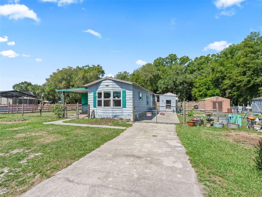 Price Reduction  !!!! OWNER MOTIVATED !!!!
Whether you're searching for your first home, a relaxing snowbird retreat, or a smart investment opportunity, this property checks all the boxes. Set on a spacious .26-acre lot with no HOA, you’ll enjoy the flexibility of country living with room to make it your own. This 2-bedroom, 1-bath manufactured home (854 sq ft) offers a comfortable and functional layout, plus a 12x20 enclosed Florida room that adds valuable living space—perfect for a second living area, home office, or seasonal enjoyment. The seller states these key updates have already been completed, including the bathroom and plumbing (2024), windows and water heater (2025), and HVAC new in 2025 and recently serviced HVAC (2026), providing peace of mind for homeowners and investors alike. Outside, the property continues to impress with fencing on both sides and along the back for added privacy, a 12x20 workshop with electric for hobbies or storage, and an 8x10 metal laundry/storage building with washer and dryer hookups. The septic system was pumped in 2025, helping minimize immediate maintenance concerns. Conveniently located with easy access to SR 471, SR 50, US 301, and I-75, this home offers a great balance of quiet living and accessibility to medical offices, shopping, farmers' markets, and entertainment. Just a short drive to Tampa, Orlando, The Villages, and Ocala. Whether you're planning to live in it full-time, use it seasonally, or add it to your rental portfolio, this property offers versatility and value.