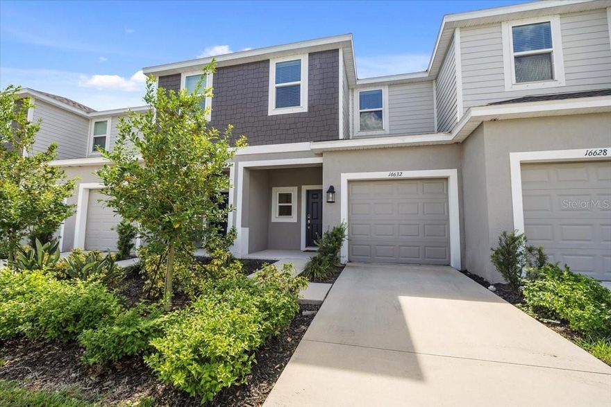 One or more photo(s) has been virtually staged. Welcome to The Townhomes at Azario in Lakewood Ranch — where style meets convenience in the heart of Florida’s #1 master-planned community!

Discover the Jasmine, a beautifully designed two-story townhome offering 1,373 square feet of thoughtfully crafted living space, featuring 3 bedrooms, 2.5 baths, and a one-car garage. Step inside from the inviting front porch into a light-filled open-concept great room and kitchen, complete with a large island—perfect for casual dining, entertaining, or gathering with family and friends.

The main level also includes a convenient half bath, access to the private outdoor patio via your custom installed planation shutters, and direct entry from the garage. Upstairs, you’ll find two guest bedrooms with a shared full bath, along with a spacious primary suite boasting a walk-in closet and a luxurious ensuite bath with dual vanities. The upstairs laundry area with a washer and dryer included makes everyday living easy. There is ample storage throughout—including a pantry, linen closet, and under-stair space—ensures everything has its place.

Outside your front door, The Townhomes at Azario welcomes you with lush landscaping, a sparkling community pool, and a pet park—the perfect blend of relaxation and recreation. Enjoy the best of Lakewood Ranch living, surrounded by top-rated schools, golf courses, dining, shopping, and the area’s famous Gulf Coast beaches—just 20 miles from downtown Sarasota and under an hour from Tampa.

Start your next chapter in one of the most desirable communities on Florida’s west coast, and experience carefree townhome living in beautiful Azario Lakewood Ranch.