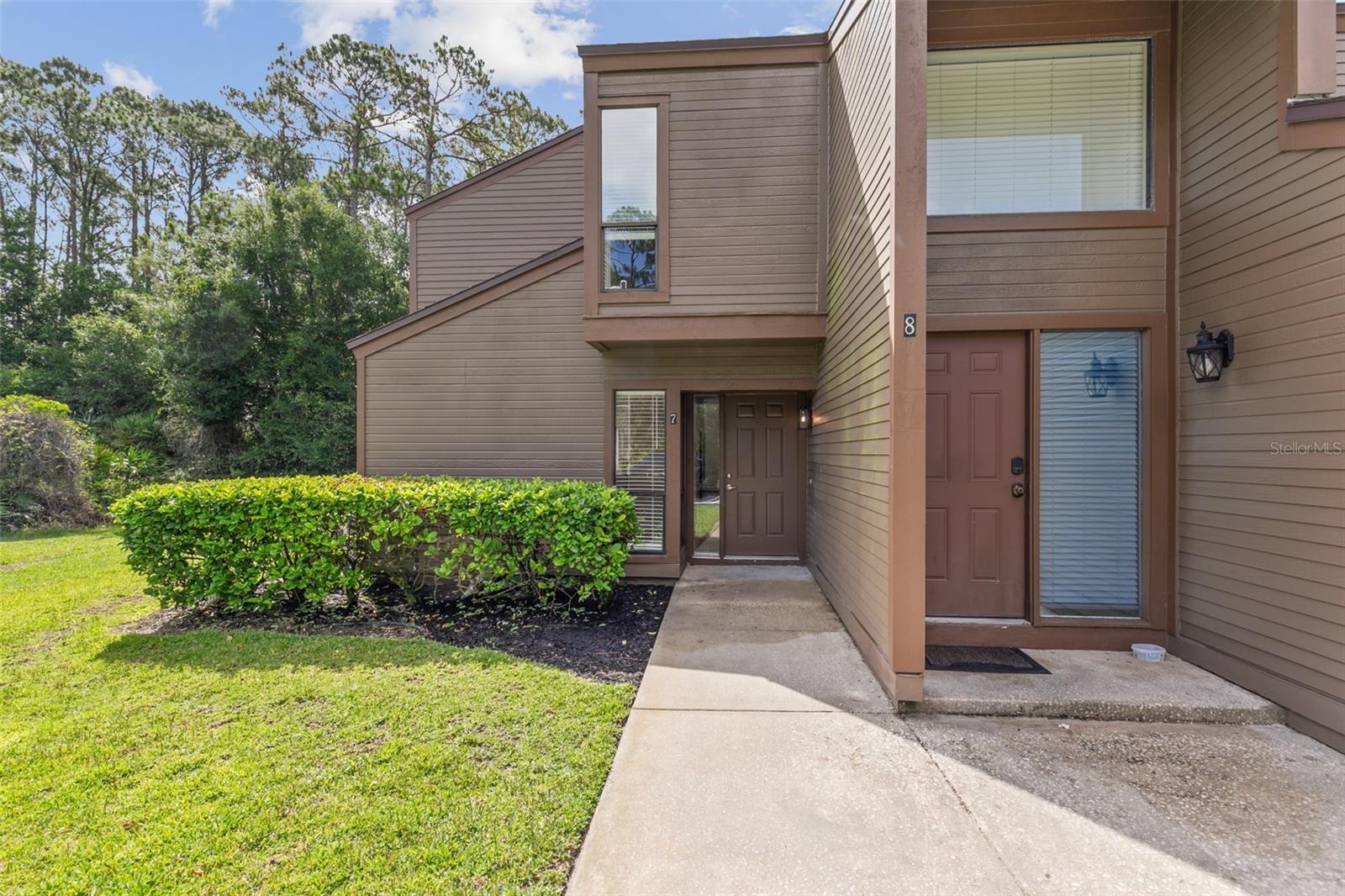 Beautifully Renovated 3BR/2BA Condo in Woodhaven – Water Included in HOA along with wonderfully amenities!! Private, Peaceful, and Move-In Ready! Welcome to this stunning lower-level 3 bedroom, 2 bath condo located in the highly desirable Woodhaven community. Nestled along tree-lined wooded frontage, this home offers exceptional privacy and a tranquil setting that’s hard to find. Renovated in 2025, this condo boasts beautiful new luxury vinyl plank (LVP) flooring throughout, a brand new A/C unit, and a fully updated kitchen featuring elegant quartz countertops, new stainless steel appliances, and a breakfast bar perfect for casual dining. A cozy breakfast nook with sliding glass doors leads to a spacious enclosed rear patio—lined with windows for abundant natural light—creating the perfect space to relax or entertain. The inviting great room and primary suite also offer direct access to the enclosed patio. The spacious primary suite includes a fully updated bathroom with a sleek walk-in shower and quartz vanity. The second full bath features a shower/tub combo and matching quartz vanity, combining comfort with modern style.
Woodhaven is a well-maintained community offering resort-style amenities including a clubhouse ideal for social gatherings, a sparkling pool, tennis courts, sauna, and fitness room. Centrally located just minutes from shopping, dining, and a short drive to the beach—this condo truly has it all. Don’t miss your opportunity to own a slice of paradise in Woodhaven—schedule your showing today!