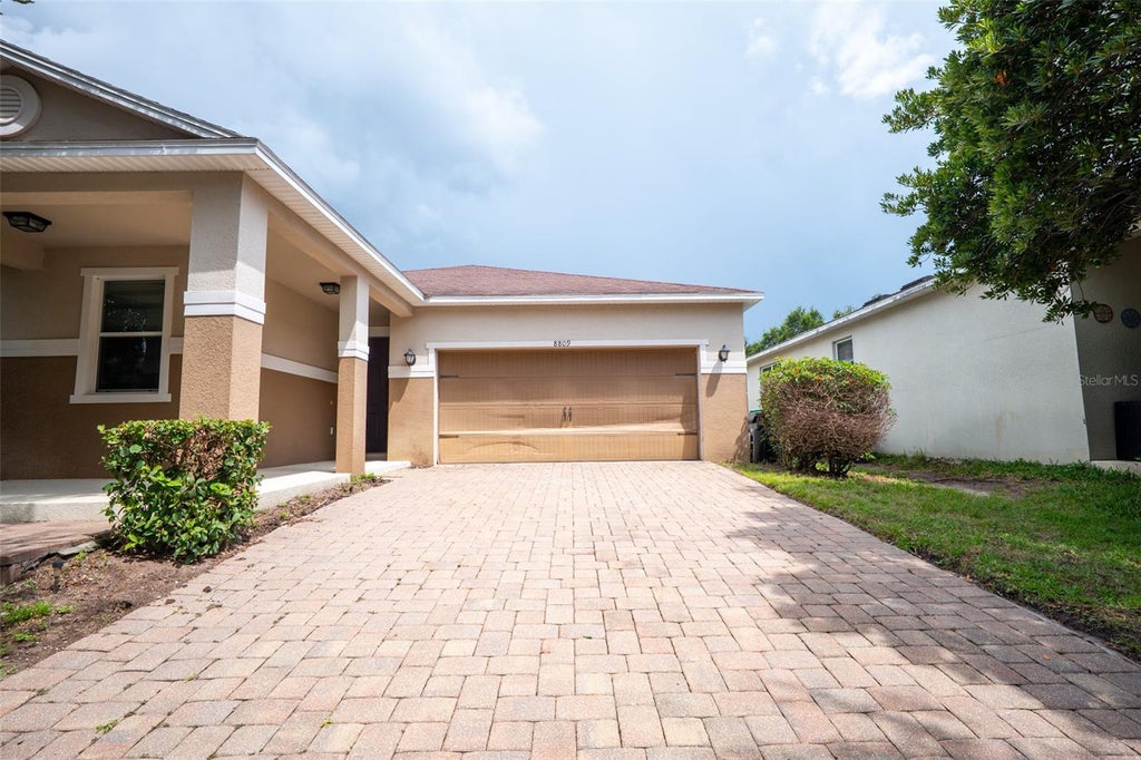 Photo of 8809 Arrabida Lane, Orlando, FL 32836 (MLS # O6445644)
