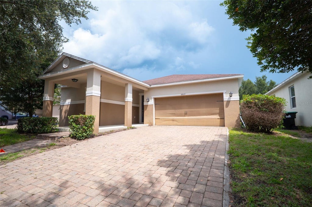 Photo of 8809 Arrabida Lane, Orlando, FL 32836 (MLS # O6445644)