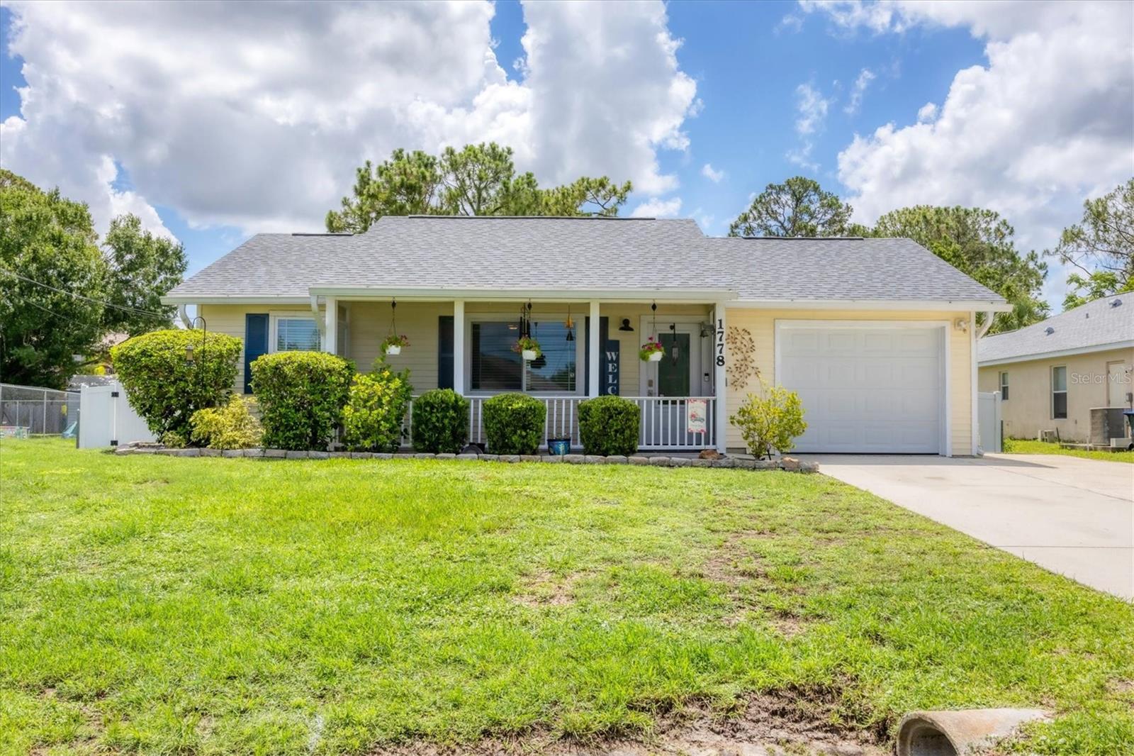 You'll discover paradise the moment you pull up to this immaculately and meticulously maintained well-appointed 2 bed / 1 bath home pleasantly situated in North Port. The amazement begins with the fantastic curb appeal garnered from the plentiful flowering shrubs as you make your way up the driveway to the front door of the home, but it certainly doesn't stop there! Inside, this almost 900 sq ft split bedroom open floor plan is fit to impress with the assistance of the tasteful floors and color palette that run throughout the living area. The dining area adds a touch of class with its sliding glass doors that let in plenty of natural sunlight and overlooks the patio area and the spacious backyard, which is ideal for enjoying your coffee on a lazy morning or a cocktail at sunset. This is truly an entertainer's dream! Adjacent to the kitchen you can enjoy breakfast in the cozy nook overlooking the backyard. Throughout this home you'll find plentiful storage but especially in the cabinets and pantry storage closet, which offer plenty of unique storage space. The primary bedroom comfortably fits a king bed with room to spare for a sitting area and features a spacious closet. The second bedroom has room for a double bed and dresser w/ mirror and plenty of closet space. From the patio area, you can head into your spacious backyard and enjoy hosting parties and cookouts on the grill. The laundry room has room for a large capacity washer and dryer with overhead shelving. The extra width, air-conditioned garage is large enough for a full-size SUV or an in-garage workshop, and the backyard has a shed to store your lawn tractor and all of your gardening tools. Enjoy the benefits of Florida's abundant sunshine, as this home is equipped with SOLAR panels for producing electricity and a TESLA Power Wall with a battery backup are included. The home is centrally located and convenient for walking or biking, and it is just minutes away from restaurants, shopping, golfing, nature preserves & state parks. The sparkling gulf beaches of Boca Grande, Siesta Key & Manasota Key are a short drive away, as is the newly opened North Port Aquatic Center. The spring training facilities of the Atlanta Braves and the Tampa Bay Rays as well as multiple airports make the area ideal as a travel destination for many. North Port is centrally located and is only a short day trip from exploring Naples, Sarasota, Tampa, Miami, and everywhere else in between! And since it is in a non-deed restricted area, it doesn't have rental restrictions, you have the option to live here comfortably year-round or stay seasonally while leasing or offering it as a vacation rental when you're not using it to help with expenses. All that is missing is YOU! Schedule your private showing today.
