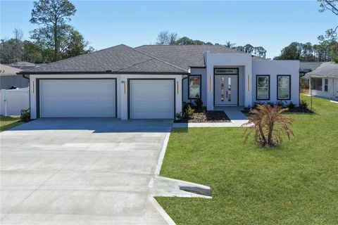 Photo of 70 Bennett Lane, Palm Coast, FL 32137 (MLS # FC316425)