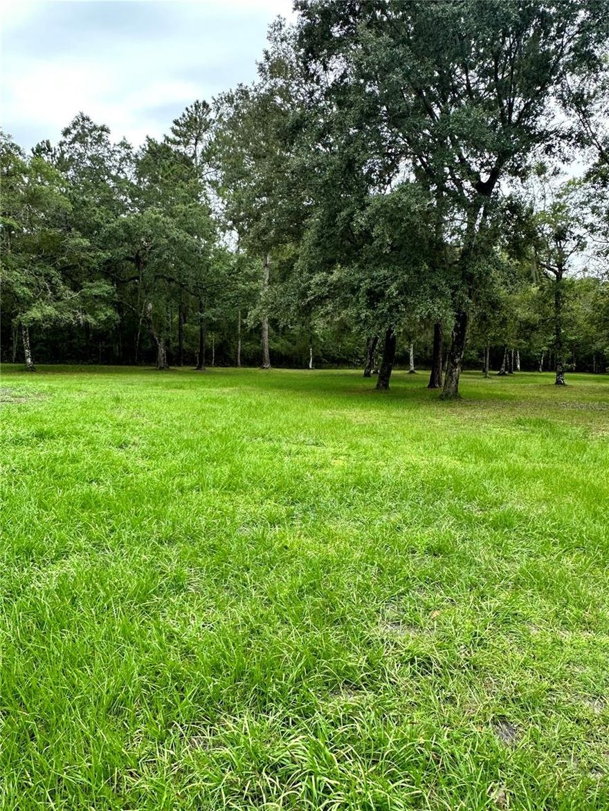 ~Ready To BUILD Your Dream Home ~ and Your Portfolio?
This Vacant 2 Buildable lots of 2.5Acre each for a Total of 5 Acres. The Lots have already been split, with survey and they each have their own Tax ID number but run concurrent...No HOA and IS Not In a flood zone~ Property IS HIGH AND DRY & Partial Cleared and ready for You to Start Planning & Building. Can Build on one and keep other one for investment or build on both. Lots of Options with these stunning lots.
Don’t miss out—land like this is a rare find! Bring it all with you…your horses, animals, RV/Camper, boat, ATVs, side-by-side, and your bicycles to ride the paved roads of this beautiful neighborhood...The Best of Both Worlds…Country Living with availability to connect high-speed internet, cable and paved roads, is close to shopping, schools & amenities. Seller will assist by paying $6,500 of buyers closing cost with full price contract! Schedule a showing today and discover why this property won’t last long. The Listing Broker is also the Owner. Seller does have a very clean 1999 Homes of Merit (1,936 SqFt 3 bedroom~2 bath with a den), that is available to purchase to use while building and/or live in~will need well & septic, and is located on adjacent property and can view if interested). Please do not approach... Must have appointment to view property. Must see to Appreciate the Unlimited Potential for this beautiful property!