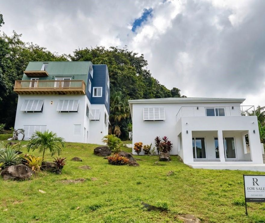 El Yunque Sanctuary: Exclusive Retreat & Nature Connection Project
Located at the foothills of El Yunque National Forest, this property of approximately one acre (one cuerda) represents the perfect opportunity to develop a wellness destination, meditation retreat, or high-end short-term rental concept. The project is 75 completed, offering the competitive advantage of having all construction permits approved, allowing the buyer to finish the work quickly with their own personal touch.
The property features a total of 7 bedrooms and 4 bathrooms across two independent structures, including a captivating wooden Tiny Home with three balconies offering spectacular ocean and mountain views. The land directly borders a crystal-clear creek, creating an unparalleled atmosphere of peace just 200 meters from the entrance to El Yunque. A blank canvas with 4,000 sq. ft. of construction, ready to become the most exclusive refuge in the area.