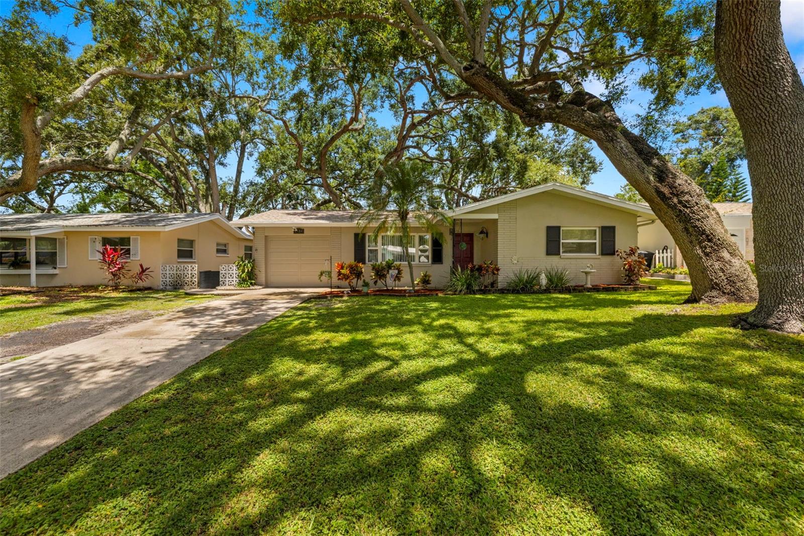 Ready to live the Florida dream? This charming 2-bedroom, 1-bath home is nestled in a quiet residential pocket of Clearwater. Whether you’re a beach lover, baseball fan, or just craving a laid-back lifestyle, this gem puts you right where the action is — without the hustle and bustle.
Step inside to an ideal blend of comfort and convenience. With a brand-new roof, you can rest easy knowing major updates are already handled. This home offers two bright and cozy bedrooms perfect for guests, roommates, or a home office setup, a functional bathroom with clean, classic finishes and an open and versatile living area with flexible space for a seating area and dining nook. Fresh landscaping and a welcoming front porch to enjoy your morning coffee. Rear yard space—enough room for a small grill, garden, or pet-friendly play zone.
A short drive places you in the vibrant downtown Dunedin, known for its independent shops, Main Street charm, craft breweries and frequent festivals TD Ballpark, home of the Dunedin Blue Jays (Spring Training and minor league team), is just a few minutes away—perfect for catching games or community events. Very close to award winning sugar-sand beaches and sunset strolls.