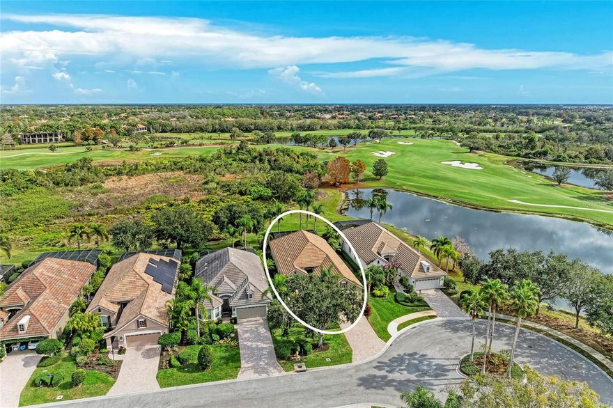Perfectly positioned at the end of a quiet cul-de-sac, this beautifully updated pool and spa home sits on one of the most coveted lots in Lakewood Ranch Country Club, offering preserve, water, and Kings Dune golf course views. Located in Stone Ridge, one of the closest neighborhoods to the Country Club and golfing amenities, is sought-after due to the proximity. Designed by Neal Communities, the popular Burgundy floor plan showcases a rare, expansive open-air courtyard with a surrounding wall, leading to a beautiful French glass entry door. Inside, a gracious foyer opens to a light-filled Great Room features architectural detailing, soaring 12-foot ceilings, diagonal tile flooring, and transom window above the double glass lanai doors, seamlessly connecting indoor and outdoor living. Formal and casual dining spaces off the kitchen are enhanced by plantation shutters and Lutron lighting, creating an elegant ambiance. The chef’s kitchen, beautifully updated in 2022, is a standout feature showcasing Calcutta Tuscany quartz countertops, custom-painted cabinetry topped with crown molding, and an illuminated glass-front upper cabinet that adds both sophistication and warmth. This refined space features a granite composite sink, glass tile backsplash, gas cooking stove, and stainless steel appliances, including several newer additions. A central vacuum system with an automatic toe-kick dustpan offers effortless convenience. The primary suite is a serene retreat featuring lanai access, a generous sitting area, custom built-in closets with no carpeting, and a lovely en-suite bath with dual vanities, a soaking tub, and a zero-entry walk-in shower. The two guest bedrooms are thoughtfully tucked behind a pocket door, creating a private wing with a shared bath, ideal for guests or family. Outdoor living truly shines with saltwater, gas-heated pool and spa with water feature, outdoor shower, and a rescreened lanai. The lanai is thoughtfully designed with two separate areas, an open space for enjoying the views and a covered entertaining area featuring ceiling speakers and a pre-wired gas line. The well-appointed laundry room offers upper cabinetry, a built-in sink, hanging rack and a top loading washer and dryer. Additional highlights include a whole-house surge protector, retractable screen doors at the front entry and lanai, a sealed roof with transferable warranty (2023), Rinnai recirculating tankless water heater (2023), Kinetico water softener and filtration system (2022), and Trane HVAC with warranty (2019). The extended garage provides space for a golf cart or additional storage and includes attic access with a pull-down ladder and shelving. Country Club membership is optional, with a variety of social, athletic, and golf memberships available, offering access to four championship golf courses, elegant clubhouses, a full-service athletic center, lap pool, fitness facilities, and a vibrant tennis and pickleball community with no wait list. Just minutes from Waterside Place, Lakewood Ranch Main Street, UTC shopping and dining, the Sarasota Polo Club, SRQ Airport, and the world-renowned Gulf Coast beaches. Low HOA fee includes lawn maintenance as an added benefit to this rare opportunity to experience the very best of Florida living.