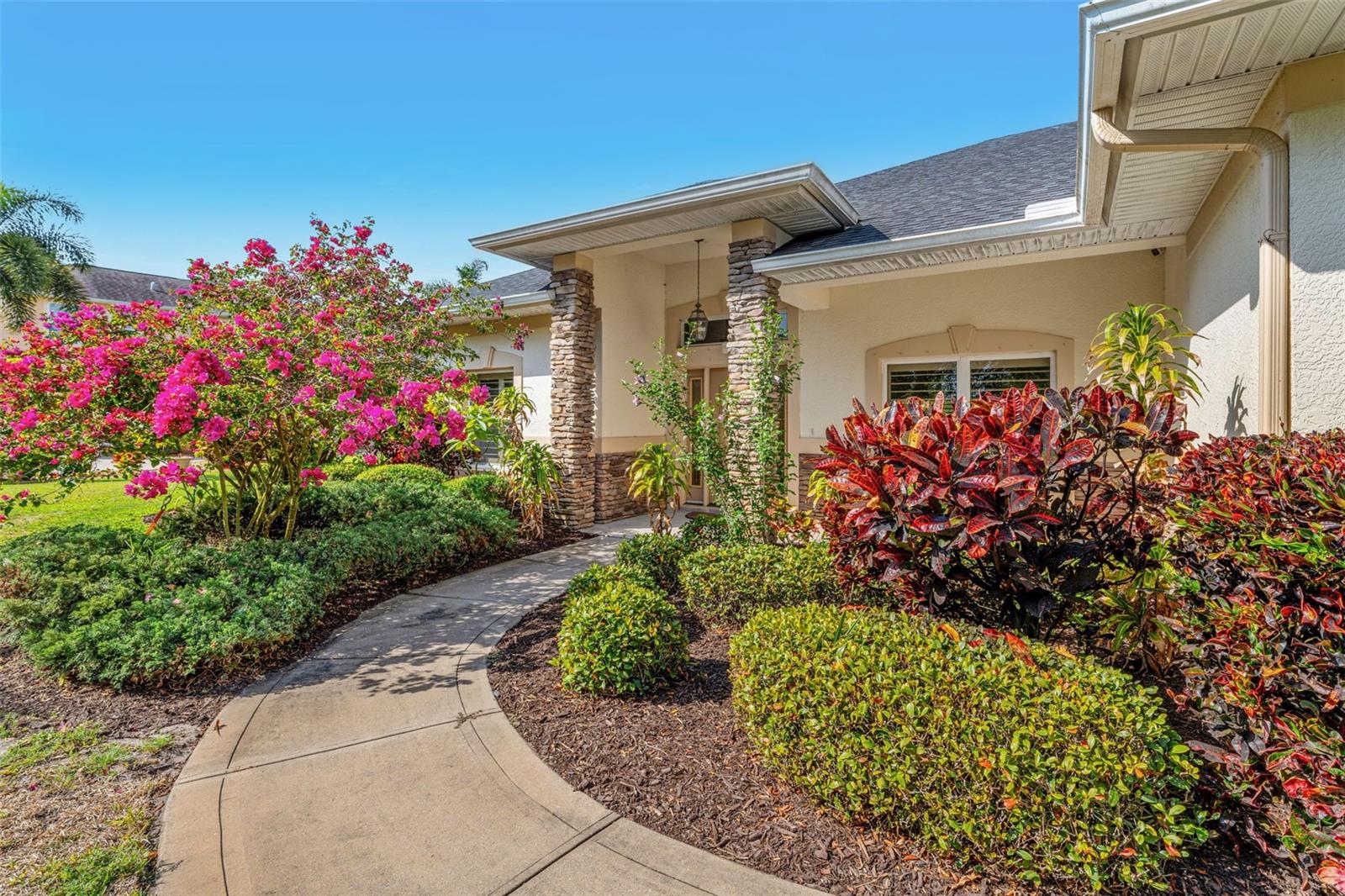 Nestled in the heart of The Plantation, a picturesque, oak and magnolia tree-lined fairy tale neighborhood, this stunning home beckons you to experience the perfect blend of comfort, elegance, and nature. From the moment you arrive, you'll be enchanted by the towering oak trees that embrace the property. This spacious residence boasts 3 bedrooms, plus a dedicated office or 4th bedroom that offers a quiet retreat for work or creativity. Each room feels grand, with soaring ceilings, impact glass windows with plantation shutters and intricate architectural details that speak to the quality and craftsmanship that define this home. Walk-in closets a walk-in pantry and oversized 750sf garage, provide ample storage, ensuring that everything has its place, making both everyday living and entertaining a breeze. Step outside, and you'll be greeted by the tranquil beauty of the pond, where the sunsets paint the sky in vibrant hues over your spacious .52 acres—an ever-changing masterpiece for you to enjoy daily. This home is a rare gem!