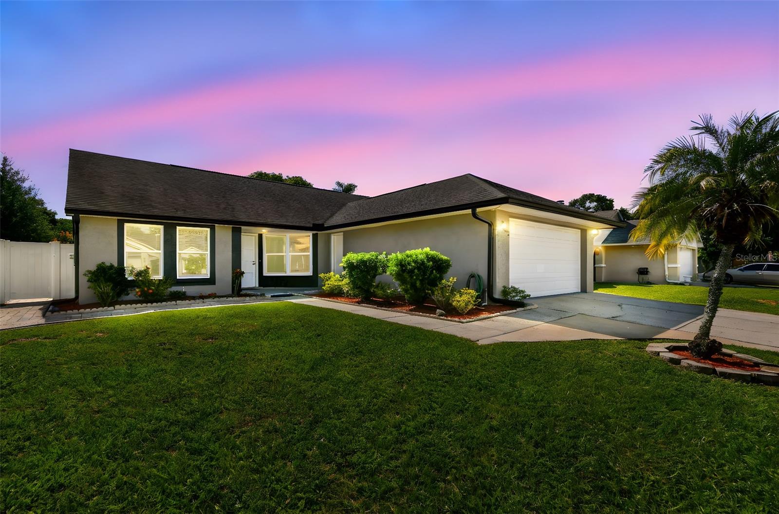 Welcome home to this remarkable house in the quiet and convenient Copperfield neighborhood. Stunning and well improved, the home boasts beautiful aery spaces with tons of natural light. A distinct 3bedroom 2 bathrooms and 2 car garage, the home is immaculate. Consistent easy maintenance tile flows throughout the home. Wonderful open concept, the LARGE great room (centered around a beautiful marble fireplace) has nice sightlines to the dining and kitchen combo. Kitchen is well updated feat..solid wood cabinets, SS Appliances, Stone Countertops, Pantry and peninsula bar. Primary bedroom is large and feat. ensuite w/ walk in shower and built out walk in closet. Two junior bedrooms are tucked to the west wing of the home with updated hall bath and INDOOR LAUNDRY in the Hallway. The back yard is simply AMAZING. Nicely landscaped and fully pavered, it is a wonderful place to enjoy those nice Florida days. Easy access to the veterans and shopping like Costco makes this a highly desirable location. Jump right on the HWY and youre at Tampa International Airport in less than 10mins! Don't miss out, come check this beauty today