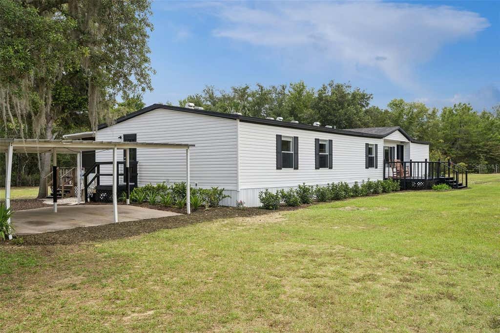 Photo of 11435 S Em En El Grove Road, Leesburg, FL 34788 (MLS # OM726515)