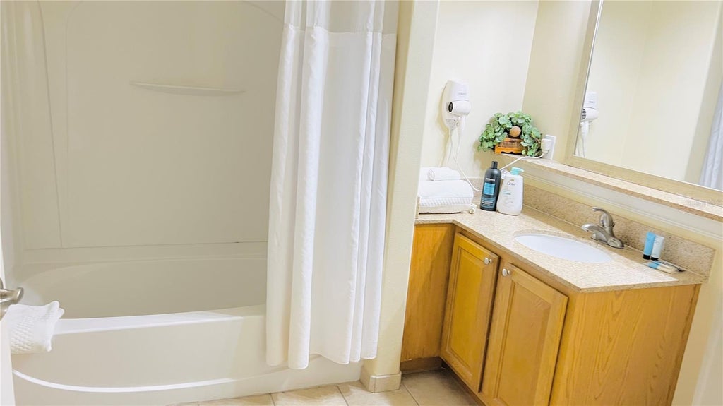 Photo of 13427 Blue Heron Beach Drive #706, Orlando, FL 32821 (MLS # O6449782)