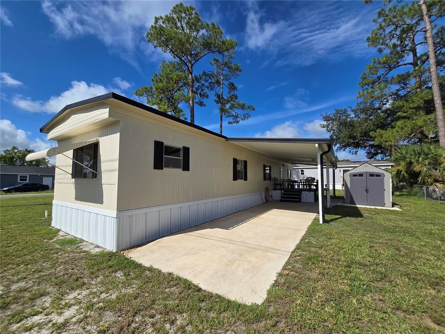 This MOVE IN READY home located in Pine Grove Park, a fisherman's paradise with easy access to the Alligator Chain of Lakes, is a must see. The boat ramp to Trout Lake is just down the street or catch the sunset at Lake Lizzie just a few blocks away.  NO HOA! You OWN the land! POSSIBLE SELLER FINANCING WITH $40,000 DOWN. This charming, updated, manufactured home sits on a beautiful corner lot and features 2 bedrooms, 2 full baths, a carport, storage shed and so much more!  The freshly painted exterior and new skirting have great curb appeal, the new luxury vinyl plank flooring throughout the home adds elegance and ease of care. Newer heat pump AC, well pump and tank offer peace of mind. The split floorplan provides privacy and maximizes square footage with a spacious living room, kitchen with stainless steel appliances, room for a dinette and plenty of cabinets.  Both of the bedrooms are good sized and have large built in closets.  The primary bedroom has its own full bath with stand up shower, the main bathroom has a tub/shower combo. Enjoy the extended living spaces offered by the covered deck with lots of seating and the huge Florida room which is screened and has vinyl windows. This home is perfect for someone looking to move right in or would also make an excellent rental investment. Cash only. Make your appointment to see it today!