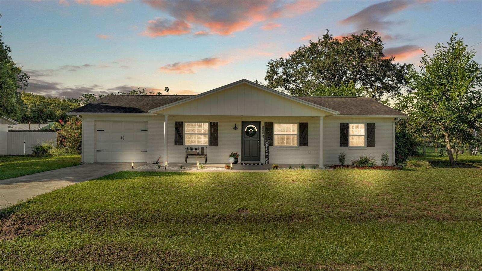 Welcome to 3727 Hill Street, a lovingly maintained and modernized 3-bedroom, 2-bath home nestled in a quiet Lakeland neighborhood. Sitting on a spacious 0.25-acre lot, this property boasts a large, open, fully fenced backyard—perfect for pets, play, gardening, or entertaining. Inside, recent updates make this home move-in ready. Improvements include a new roof (2014), A/C system (2022), freshly painted interior and exterior, brand-new carpeting in the bedrooms, stylish new bathroom vanities, and a full set of new kitchen appliances. Updates blend comfort with modern style, creating a bright and welcoming atmosphere. The home’s layout offers a seamless flow between living areas, making it ideal for both everyday living and family gatherings. Natural light fill the rooms, adding to the warm and inviting feel throughout. Located in a USDA-eligible area, this home qualifies for 100% financing with $0 down—an excellent opportunity for first-time buyers or those looking to maximize value. Conveniently close to schools, shopping, dining, and major roadways - the perfect balance of comfort, convenience, and affordability.