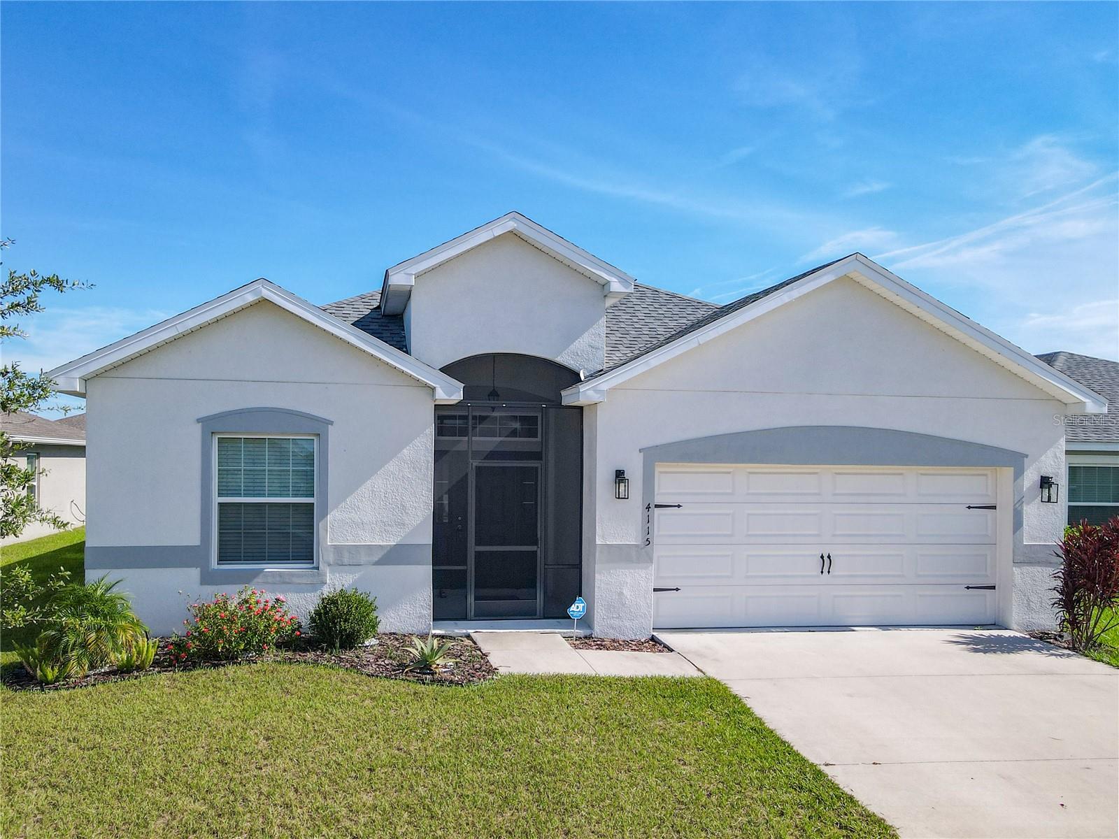 Nestled in the vibrant and growing community of Haines City, this 4-bedroom, 2-bathroom home is the perfect blend of modern design, smart upgrades, and everyday comfort. Built in 2022 and offering 2,032 sq. ft. of thoughtfully planned living space, it comes equipped with energy-saving BRAND NEW SOLAR PANELS and a fully paid-off PURE TOUCH WATER FILTRATION SYSTEM—both adding lasting value and convenience. Inside, an airy open floor plan seamlessly connects the living area, dining space, and a sleek kitchen featuring stainless steel appliances, plentiful cabinetry, and generous counters that inspire both casual meals and gourmet creations. The primary suite offers a private retreat with its own bath and walk-in closet, while three additional bedrooms adapt easily for guests, family, or a home office. A roomy laundry/mud area off the garage keeps things organized, and the screened front porch and lanai provide the perfect spots to enjoy Florida’s melow evenings—made even better by a private backyard with no rear neighbors. Just a short walk to community amenities like a pool, playground, dog park, and soccer field, and minutes from Legoland with easy access to Tampa and Orlando, this home offers small-town charm without sacrificing convenience. Ready to welcome its next owner, it’s a move-in ready opportunity you won’t want to miss. SAVE BIG ON this home !