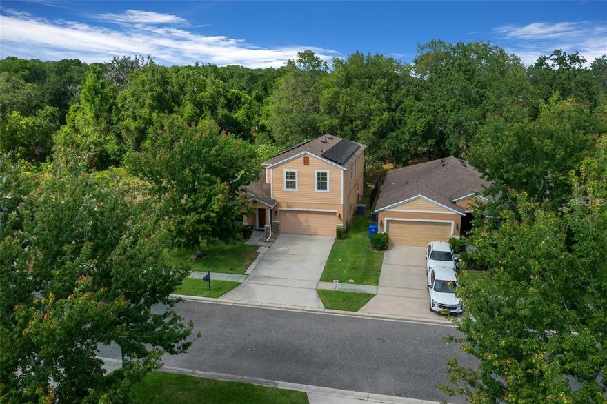 Welcome to this well-appointed 5-bedroom, 3.5-bathroom two-story residence ideally situated near Lake Harris and the Harris Chain of Lakes, offering convenient access to premier boating, fishing, and outdoor recreation.

Located within the gated community of Oak Bend, residents enjoy a secure setting complemented by tree-lined streets, sidewalks, and access to a community pool. Positioned at the end of a quiet cul-de-sac, the property offers enhanced privacy along the perimeter of the neighborhood.

The interior features a functional and spacious layout, beginning with a formal living area that transitions into an expansive great room combining the kitchen, dining, and family areas—well-suited for both everyday living and entertaining. The kitchen and dining space overlook a screened-in porch, providing an ideal setting for outdoor relaxation.

The main level includes a convenient half bath for guests, along with a generously sized primary suite featuring a large walk-in closet and a well-appointed ensuite bathroom designed for comfort and privacy.

Upstairs, you’ll find a versatile loft or game room, four additional bedrooms, and two full bathrooms, offering ample space for family or guests.

Additional highlights include an oversized hot tub and solar panel system, contributing to improved energy efficiency and reduced utility costs.

This property offers a balanced combination of space, functionality, and location within a desirable community setting.