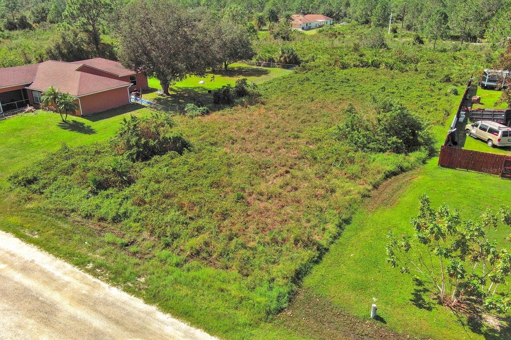 Photo of 1413 5th Avenue, Lehigh Acres, FL 33972 (MLS # O6344875)