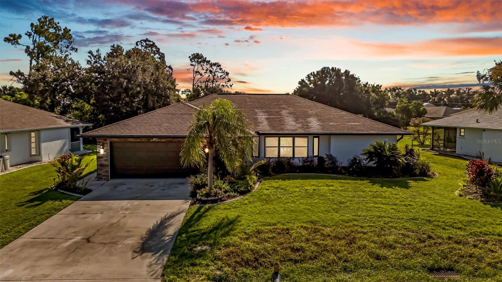Punta Gorda, Deep Creek - Completely Renovated 3/2/2 Pool-Home! Located in the deed-restricted community of Deep Creek and privately situated on a greenbelt, this 3BR/2BA, 1,944sqft property has been immaculately remodeled and shows like a model home. Approaching the refreshed exterior, you will notice the nice brick work, tropical landscaping, and the convenient screened-in covered entryway. Enter the updated interior to discover new gleaming tile floors, luxurious light fixtures, and a truly open concept floorplan. Designed for gourmets and those who entertain, the chef’s kitchen features quartz countertops, 42” self-close shaker wood cabinetry, stainless-steel appliances, electric range/oven with matching hood vent, center island w/seating for five, built-in microwave, dishwasher, glass tile backsplash, and an adjoining dining area w/dazzling light fixture. Find true relaxation in the master bedroom featuring a deep closet, sliding glass doors to the lanai, and a updated en-suite with dual sinks, quartz countertops, glass enclosed shower, and custom tilework. Two additional bedrooms are abundantly sized w/dedicated walk-in closets, and one guest bedroom even has direct lanai access. For out door dining evenings or lively parties, the fully screened-in and covered patio offers plenty of room for grilling, chilling, and dining. You will certainly enjoy dipping or sitting by the large sparkling swimming pool! Other features: attached 2-car garage, in-side laundry room w/utility sink and counter space, guest bathroom w/quartz countertops and lanai access, city water/sewer, NOT in flood zone, low HOA fees, new roof (2021), newer A/C (Feb.2017), near shops, dining, and schools, and more! Call now for a tour!