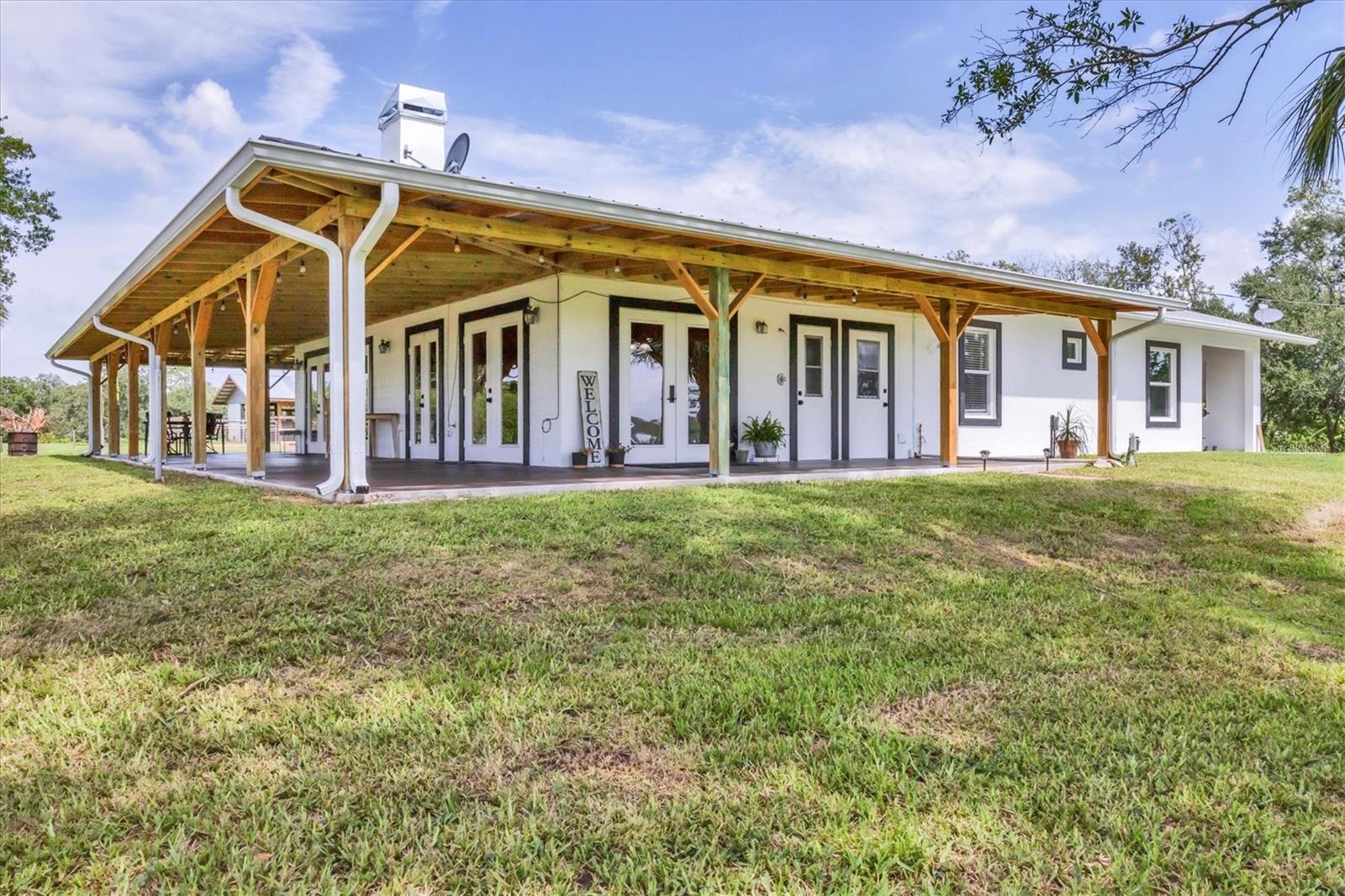 Welcome to your private ranch style homestead! Sitting on 37 picturesque acres, this property offers the perfect blend of comfort, space, and functionality for country living.
The 4-bedroom, 2.5-bathroom home boasts an inviting layout, perfect for family living or entertaining. Natural light floods the interior, highlighting the warm Saltillo style tile floors, cozy living areas, and an open kitchen ideal for preparing meals with a view of the sprawling landscape. An ensuite and additional bedroom and bathroom were recently added within the last two years. The addition has wood grained waterproof vinyl floors and wood-stained trim throughout. A newly constructed wrap around porch with metal roof was installed in March 2025.
Equestrian lovers will appreciate the concrete five-stall horse barn, with tack room. The barn is also multipurpose as a dog kennel that can be used for boarding, breeding or training. There is also a large arena that can be used for horse training, exercising or provide a space for teaching riding lessons.
A detached garage adds even more utility, perfect for storing vehicles, equipment, or transforming into a workshop. The land itself is a mix of open pasture and wooded areas, ideal for riding, recreation, or simply enjoying the peace and privacy of rural life.
Whether you're seeking a private family retreat, a hobby farm, or a place to bring your animals and live off the land, this rare offering has many potential uses. There are two parcels being sold together. No HOA or deed restrictions. Located approximately 20 minutes to Lakewood Ranch and 30 minutes to Sarasota.