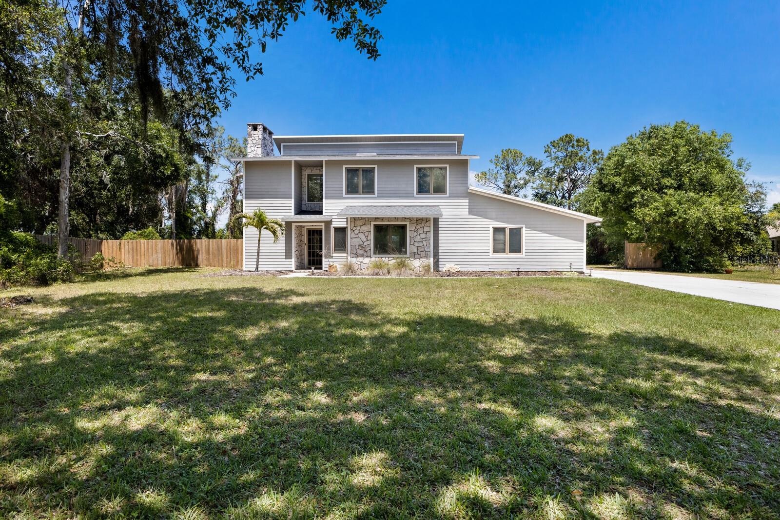 Coastal Country Living! Discover the rare opportunity to enjoy true freedom with NO HOA, NO CDD, and NO Deed Restrictions. Park your boat, RV, trailer, or build the workshop of your dreams without limitations. This beautifully renovated 3-bedroom, 2.5-bath pool home with a den, bonus room, and oversized 3-car garage is tucked away on over an acre at the end of a quiet cul-de-sac, offering privacy, space, and versatility that’s nearly impossible to find in Lakewood Ranch area. Set on a private lot backing up to a tranquil 13-acre lake with no rear neighbors, this two-story home gives you the peacefulness of country living while being just minutes from I-75, A-rated schools, and all the upscale shopping and dining Lakewood Ranch is known for. Plus, you’re only a short drive from some of Florida’s most stunning Gulf Coast beaches, including Siesta Key, Longboat Key, and Anna Maria Island. Inside, the home has been thoughtfully updated with modern style and premium finishes. The main level features wood-look vinyl plank throughout, a spacious great room, a fully updated kitchen with Brazilian quartzite countertops, farmhouse sink, custom oak cabinetry, stainless steel appliances, a breakfast nook, and pantry. There’s also a versatile den that can serve as a formal dining room or home office, a granite half bath, and a large storage/media closet. Upstairs, the primary suite includes a walk-in closet and full bath, along with two guest bedrooms, an additional full bath, and a generous bonus room that could easily be used as a fourth bedroom, office, or playroom. Both the primary bedroom and bonus room have access to a screened-in second-story porch overlooking the pool and private backyard. Step outside to your own backyard oasis featuring a pool with a custom safety net and an expansive concrete patio perfect for outdoor entertaining. Just beyond the pool is a newly cleared, leveled field, ideal for kids, pets, or even a volleyball court. There’s plenty of room to add a detached garage, accessory dwelling, or anything else you can imagine. Recent upgrades include a newer Atlas roof and newer A/C system, newer water heater, custom marble fireplace, shiplap accents. This home delivers the best of both worlds—private, unrestricted living with all the conveniences of Lakewood Ranch just around the corner. If you're looking for space, flexibility, and freedom in one of the most desirable areas on Florida’s Gulf Coast, this property is a must see.