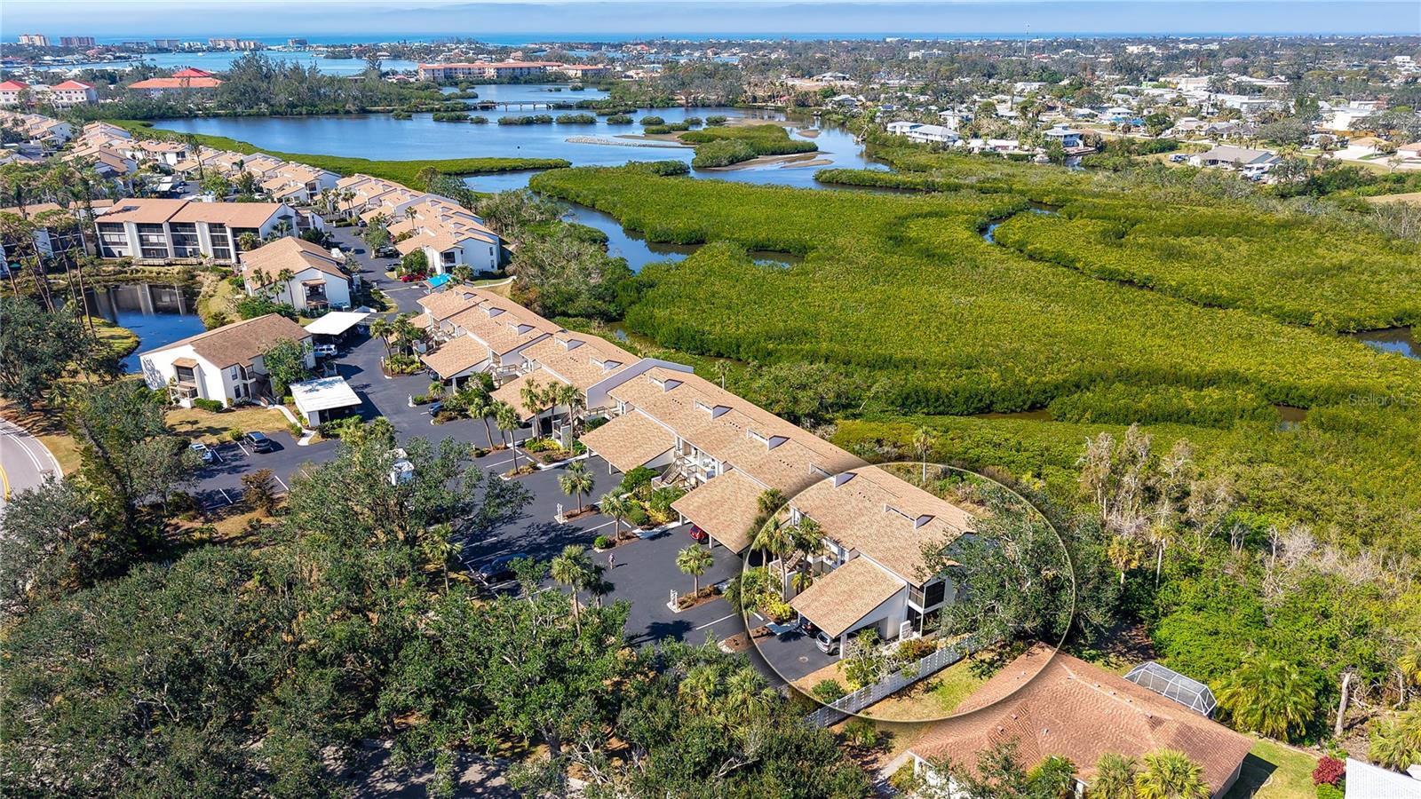 Impressive PRESERVE views and priced to sell! Gorgeous UPDATED 3 Bedroom, 2 Bathroom End Unit condo in the popular BIRD BAY community! Located at the end of a dead end street for even more privacy. The spacious covered, screened in lanai almost runs the entire back of the condo, has a wall of sliding glass patio doors to take in the captivating sights and sounds of nature everyday and stunning SUNSETS in the evenings, PLUS the furniture in the lanai is included. You will LOVE this gourmet updated kitchen with granite countertops, on trend tile backsplash, stainless appliances and convenient pull out drawers in the pantry. There's a second cozy covered lanai just off the kitchen, perfect for letting in those warm breezes, along with a laundry closet with your own full sized washer and dryer located inside. The open concept Dining/Living area has soaring vaulted ceilings for a light and airy feel inside. The Primary and Second Bedrooms have fabulous views of the preserve. Both bathrooms are UPDATED with beautiful granite countertops and neutral tile complimenting the designer inspired finishes found inside. Many more upgrades to list including light fixtures, blinds (including pull down privacy shades in both lanais) interior doors and beautiful laminate flooring throughout. New A/C in 2024. New washer in 2024. Roof replaced on the condo building in 2024. Bird Bay is a resort style community in a great location with all kinds of amenities to enjoy from community pools, pickleball and tennis courts, fitness room, clubhouse and much more! Only a few miles to Venice beach and all Venice Island has waiting for you to discover. Close to delicious restaurants, boutique shoppes, festivals, golfing, fishing, boating and much more. The Legacy Bike Trail and Venetian Waterway park are close by and another great way to explore the area and stay fit. This is vacation living at it's BEST and now sold partially furnished!