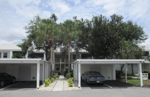 Move in ready 2 bedroom 2 bath first floor condo located in beautiful Plantation Golf & Country Club. Spacious great room with sliders to an enclosed lanai/patio overlooking the golf course for viewing enjoyment. Primary bedroom features dressing room, ensuite with double sinks and access to lanai/patio. Nice sized second bedroom. Also includes covered carport with storage. Close to all the amazing dining, entertainment, beaches, medical and shopping venues Venice has at your disposal.