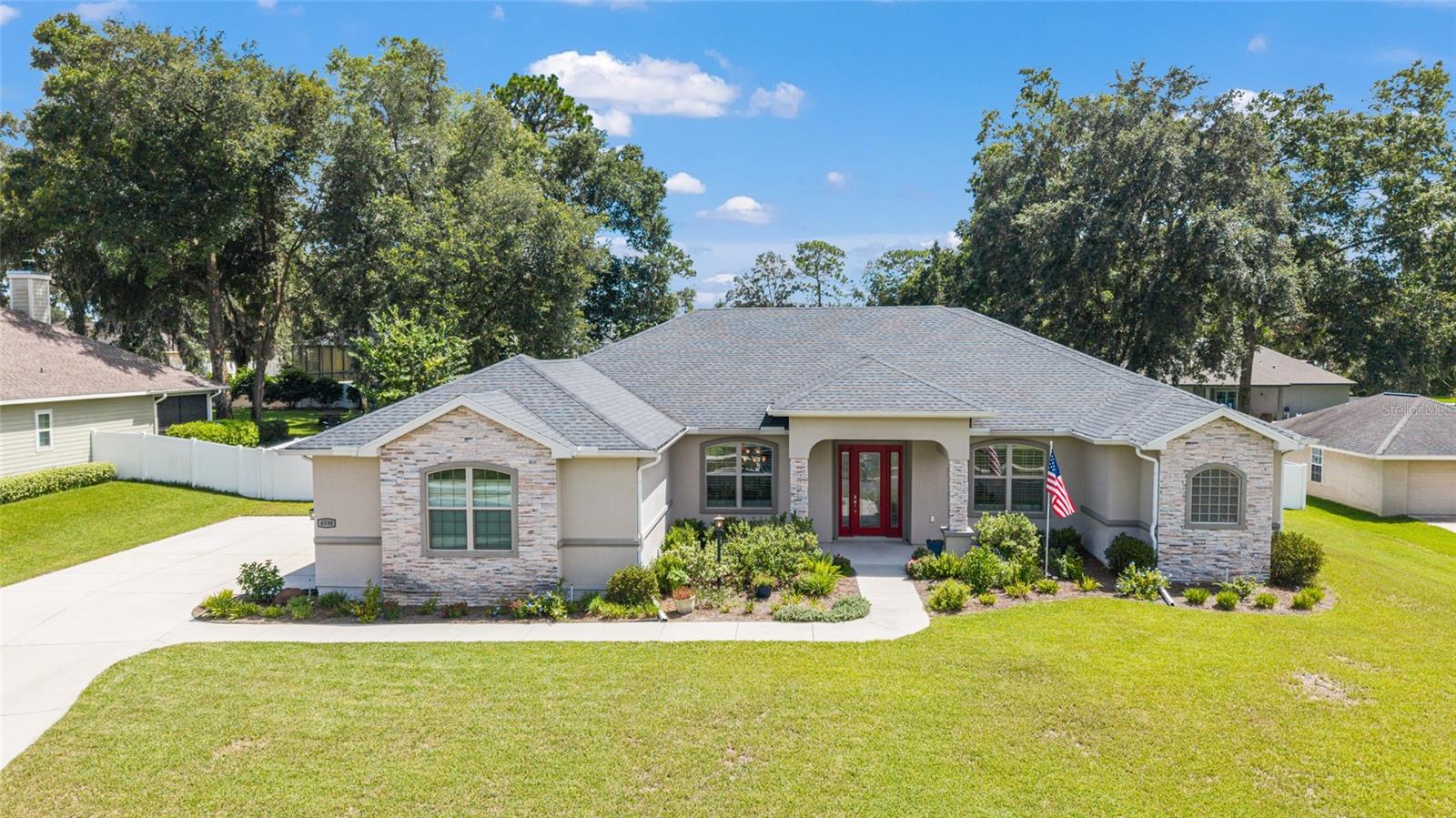 Fabulous custom designed pool/spa and beautifully landscaped back yard! Florida living at it's best! In a gated southeast community, this gorgeous 4 bedroom/3 bath home has 10 foot ceilings throughout. You will love the open layout with great views of the pool and garden. The main bedroom is huge and has a lovely tray ceiling feature. There is plenty of room for a sitting area/office. The ensuite includes double vanities, 2 walk-in closets and a private water closet. The split bedroom plan gives everyone space. The 4th bedroom/office/den has a closet and glass French doors. Custom shutters and beautiful roll down shades give privacy without obstructing the views. Lots of natural light makes this home seem happy and bright. The kitchen sports beautiful wood cabinetry and an island, along with double ovens! One can be convection. A breakfast bar is next to a casual family room opening to the pool. The home has been meticulously maintained is equipped and with 2 water heaters...never run out! The inside laundry accesses the oversized side entry garage. It is near to all the shopping and entertainment opportunities in Ocala. Close to Jervey Gantt Park, the YMCA, grocers and good restaurants. Watch the visual tour for details such as the waterfall into the pool and the lovely gardens. Don't miss this one!