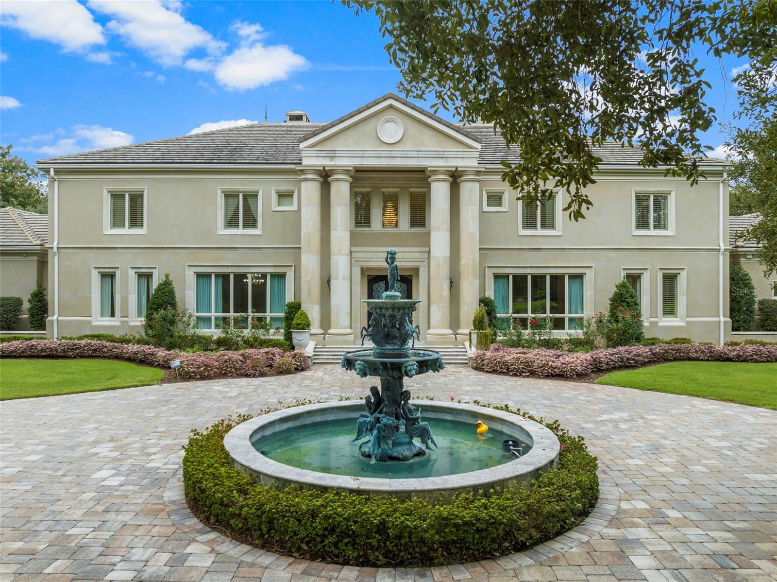 This exclusive Waterfront luxury Estate is situated on a private 4.5 acre lot, surrounded by beautiful landscaping and majestic oak trees. With over 281 feet of deep water frontage on Joe's Bayou, this hidden gem is located in the heart of Destin. The spacious home offers a range of luxurious features.
The master suite wing provides a serene retreat, featuring a bedroom with a large sitting area, a cozy fireplace, a generous dressing closet room, an exercise room with full-length mirrors, and an Italian marble tile master bath. Start your day with ease at the convenient coffee bar within your suite while enjoying breathtaking views of Joe's Bayou.
The grand room impresses with its soaring ceiling, stone floors, and French doors that open to an area with a heated pool and spa overlooking the bayou. For the culinary enthusiast, the gourmet kitchen is a chef's dream. Equipped with high-end appliances, a pantry for all your culinary delights, and a butler's pantry for seamless entertaining, this kitchen is both stylish and functional with stone floors and granite counters.
On the second floor, you'll find an entertainment living room complete with a full-size bar, ice maker, bar refrigerator, and media area. Additionally, there are five bedrooms on this floor. The estate also offers a sandy beach, a fire pit area, and a deep-water dock with two large deep water boat slips. One of the slips even includes a 40lb. lift capable of accommodating a 55' boat.
Every plant and tree on this meticulously manicured estate has been hand-selected. Other notable features include a handicap-ready bedroom and bath on the first floor, a central surround sound system, a Smart Home system, a large heated pool, and much more.
Embrace the seamless blend of indoor and outdoor living as you enjoy the picturesque surroundings of Joe's Bayou. Whether you're entertaining guests or savoring a quiet moment, this property offers a lifestyle that is nothing short of extraordinary.