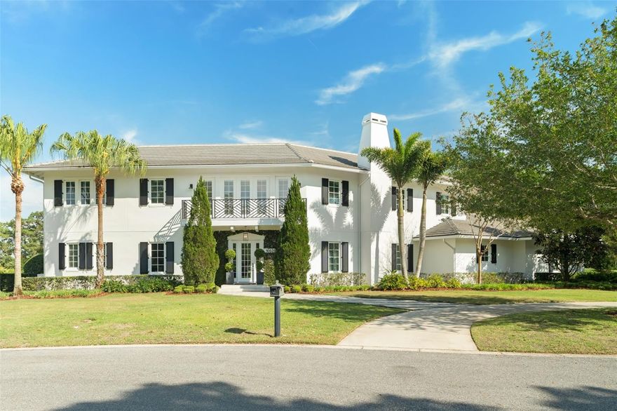 Welcome to this stunning home designed by Phil Kean nestled within one of Orlando’s most coveted neighborhoods, Lake Nona Golf & Country Club. The home’s architecture is inspired by West Indies/Dutch architecture and is situated on just over half an acre. This home has 5-bedrooms, 4-full baths, and 2 half bathrooms and offers more than 4400 square feet of living space featuring an abundance of thoughtful detail. The gorgeous wide plank flooring extends throughout the entire downstairs and upstairs of the home, and there are designer fixtures and elevated finishes throughout.  This home has lovely natural light that comes in from the wall of French doors that overlook the large backyard and beautiful pool area. The formal living and dining room center around a brick fireplace, creating an extremely cozy feel. Natural light pours into the exquisitely designed chef's kitchen featuring luxury wood cabinetry, an oversized gas range, Quartz countertops with waterfall edge, handcrafted tile backsplash, stainless steel Thermador appliances, and a walk-in pantry. The kitchen offers an eat-in space and is open to the family room with views of the expansive and private back yard. This home has dual master suites, one downstairs and one upstairs. The downstairs master bedroom features a very nice en-suite bathroom and walk in closet as well as a set of French doors that lead out to the backyard. Right outside from the downstairs master bedroom is a nicely tiled porch- the perfect place for your morning coffee. Adjacent to the downstairs master is large office and just beyond that is the incredible temperature controlled walk-in wine cellar. Two additional half-bathrooms are located on the main floor and have been designed with wallpaper and elevated lighting and fixtures. The upstairs master has its very own spa-like en-suite bathroom which includes a double vanity, custom walk-in closet, freestanding soaking tub and a beautiful basket-weave tile flooring. The master bedroom also has incredible views of the second hole of the golf course. Upstairs there are 3 additional bedrooms, two full bathrooms, an open loft area and tons of storage. This home has a large laundry room, with a built-in desk area and plenty of storage space. The patio off the family room has retractable screens for year-round outdoor living and entertainment. The summer kitchen features a grill, refrigerator and sink area, all set in front of a patterned tile wall. The driveway with paver and grass detail leads to the oversized 3-car garage. Lake Nona Golf and Country Club is just minutes to the USTA Tennis Center, Medical City, Lake Nona Town Center, and OIA - all you could ask for and more is right outside your door. Lake Nona is a highly sought-after location close to excellent schools, shopping, banking, golfing, entertainment and recreational venues. Make your appointment today.