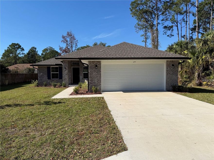 This well-designed 1,505 sq. ft. home features high ceilings and a desirable split-bedroom layout with a bright, open-concept great room and durable vinyl flooring. The primary suite includes a spacious walk-in closet, dual vanities, and a walk-in shower. The kitchen offers 36" upper cabinets with crown molding and a complete Whirlpool appliance package, including a range, microwave, dishwasher, and garbage disposal. Additional features include a built-in Home Defense Pest Control System, full insulation, and energy-efficient double-pane windows. Step outside to the oversized lanai, perfect for unwinding or entertaining guests. Ideally located in Palm Coast, residents enjoy close proximity to pristine beaches, excellent schools, shopping, dining, golf and tennis facilities, parks, boating, fishing, and an extensive network of walking and biking trails.