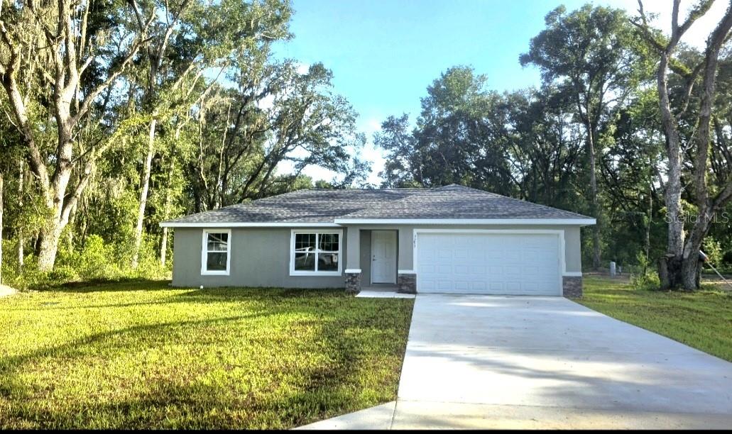 One or more photo(s) has been virtually staged. Welcome home! This brand-new construction is situated in the highly sought-after Lake Weir Gardens, right on a paved road. Conveniently located between Ocala and The Villages with very close commute to 4841. Builder warranty included! Featuring attractive colors throughout, vinyl plank flooring in every room, and beautiful granite countertops. This home is COMPLETE and ready for you to start your new chapter and experience the Florida lifestyle!