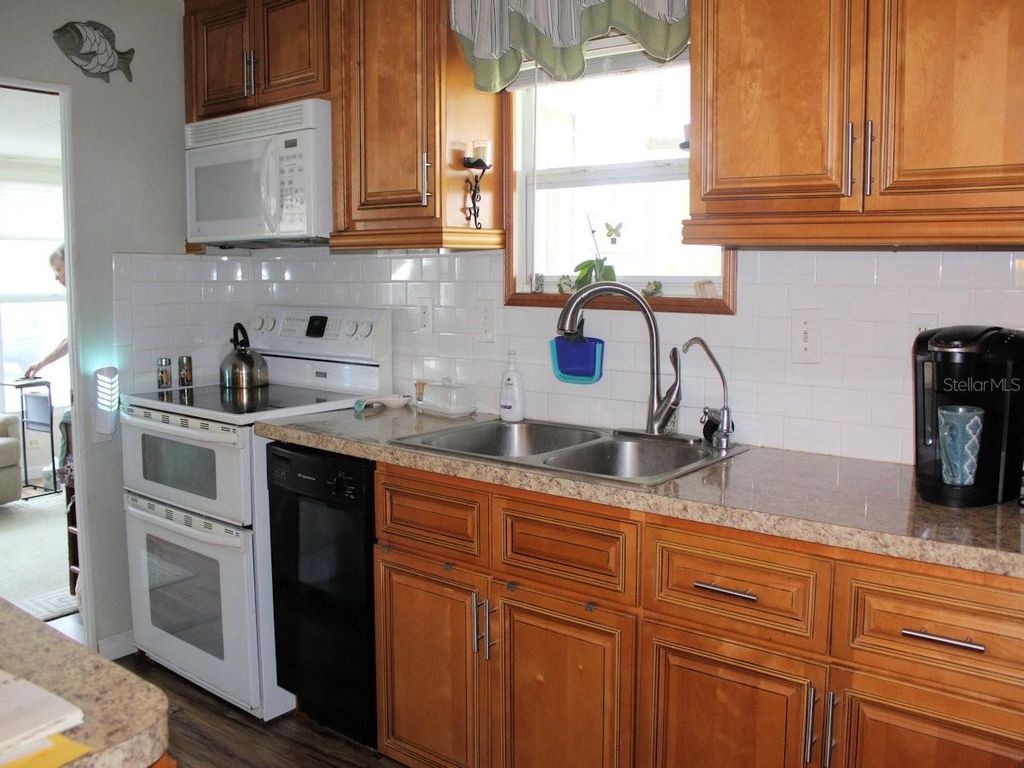 Photo of 69 Thatch Palm Street E, Largo, FL 33770 (MLS # TB8437880)