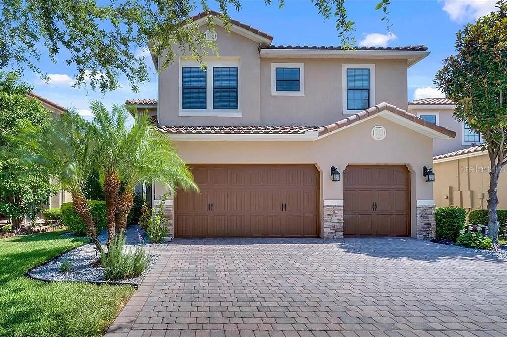 This amazing 5 bedroom, 4 bath home is designed for entertaining and families. As you enter, you will love the open floor plan, formal dining room, and separate family and living rooms which all lead out to a covered lanai overlooking the golf course. The large kitchen features 42" dark wood upper cabinets, stone countertops, stainless steel appliances, a butler pantry, and breakfast/wine bar. Upgrades include upstairs laminate wood flooring, tray ceilings, blinds, valances, soaring ceilings, decorative fans and an upgraded master bathroom. Upstairs features a 21x15 master bedroom with his and hers double walk-in closets. The four other bedrooms upstairs include a large bedroom perfect for theatre room or a second master bedroom. Two bedrooms connect with a Jack and Jill bathroom. This home has plenty of room for storage including a 3-car garage. Stylish pavers enhance the driveway and patio. This lovely community offers a 24-hour manned gate and a short walk to the clubhouse. The excellent K-12 schools are just minutes away. The abundant community amenities include multiple pools, splash park, fitness center, 4 tennis and 2 basketball courts, dog park, ball field, and public golf course. This property is conveniently located near Lake Nona Medical City, 25 minutes to downtown Orlando, 30 minutes to Disney, and 45 minutes from East Coast Beaches. The home recently had all the carpet replaced with the matching wood plank laminate flooring in the rest of the house. The exterior of the home and the roof were just pressure washed and looks amazing.