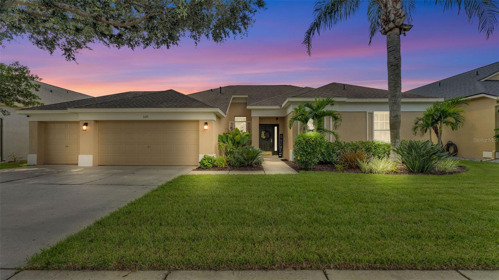 Welcome to 5123 Whispering Leaf Trail, nestled in the sought-after Twin Lakes Community of Valrico! This beautifully maintained 4-bedroom, 3-bathroom home offers 2,601 sq. ft. of comfortable living with a thoughtful 3-way split floor plan perfect for both everyday living and entertaining guests. Community has some amazing walking trails, community pool and playground. From the moment you arrive, the manicured lawn, fresh exterior paint, and lush landscaping set the tone for the curb appeal of this residence. A 3-car garage provides plenty of space for vehicles and storage. Step inside, and you’ll be greeted by a bright, open atmosphere with picture windows that fill the living areas with natural light. The formal living room, complete with a fireplace, creates a cozy focal point and an ideal spot for the family Christmas tree. A dedicated office sits at the front of the home, while the formal dining room flows seamlessly off the kitchen, perfect for hosting holiday dinners and special gatherings. The spacious kitchen overlooks the living room, keeping everyone connected, and offers plenty of storage and prep space. The primary suite is a true retreat, featuring dual closets, custom windows, and French doors that open directly to the screened patio. The en-suite bathroom includes dual vanities, a garden tub, and a walk-in shower. The split plan offers a guest or in-law bedroom and bath separate from the latter 2 bedrooms with a shared bathroom. Offering multi- generational family living, generously sized rooms offering privacy and comfort for family members or visitors. Step outside to the recently rescreened patio, an inviting spot for morning coffee or evening entertaining. With a fully fenced backyard, you’ll enjoy complete privacy. Major updates bring peace of mind: a 6-year-old AC, tankless propane water heater, and roof. Twin Lakes residents enjoy community amenities including a large park with playground, basketball and tennis courts, pool, and scenic lakes, plus, the home is just around the corner from the River Hills 18-hole golf course. If you’ve been searching for a spacious, move-in ready home in a picture-perfect setting, this one is not to be missed.