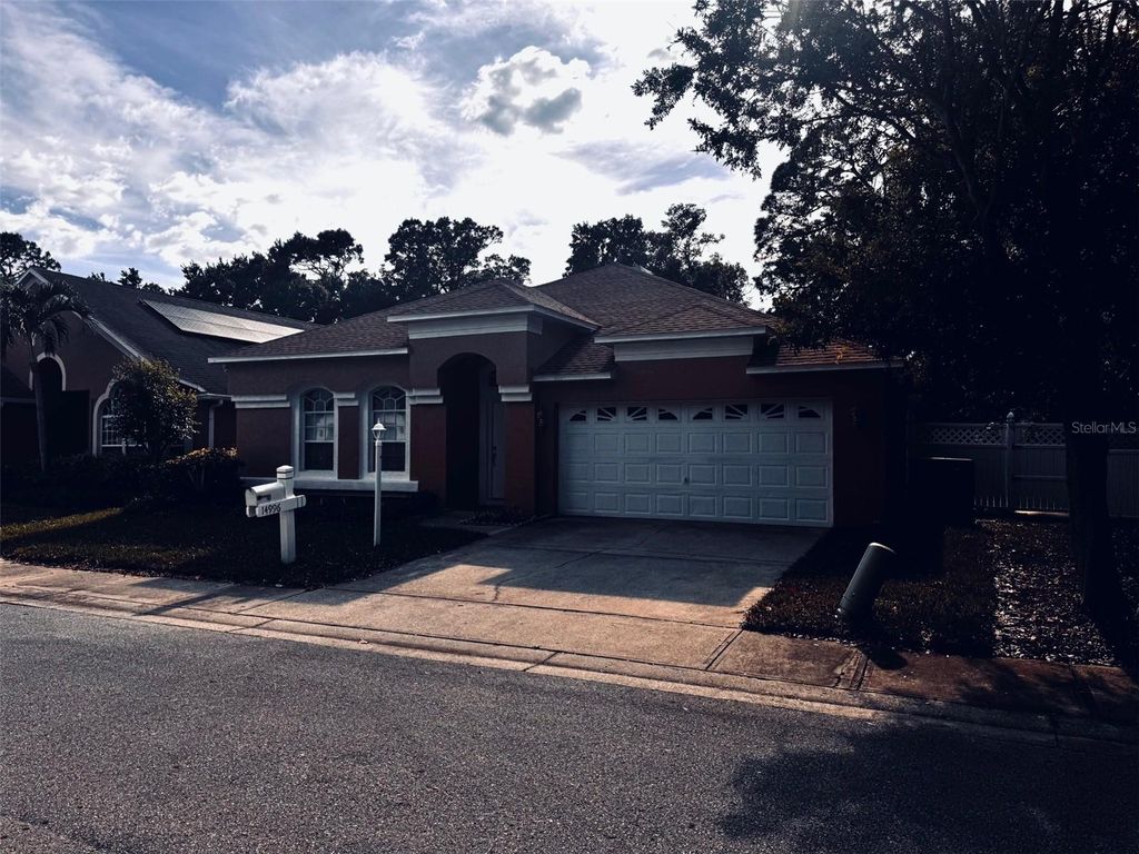 Photo of 14996 Hidden Oaks Circle, Clearwater, FL 33764 (MLS # TB8499723)