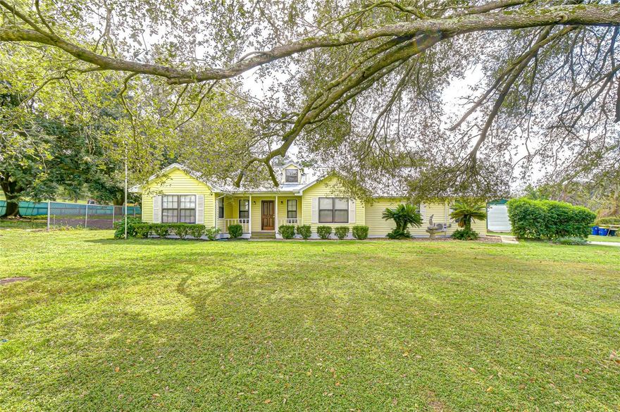 Completely remodeled and perfectly situated on 2.87 acres in the rolling hills of Dade City’s Blanton area, this 3 bedroom, 2 bath + bonus room pool home offers an expansive open floor plan living space, stunning upgrades, and a beautiful outdoor setting perfect for comfortable rural living. Arrive at this serene property down a long, welcoming driveway lined with mature trees, leading to a spacious parking pad and a detached 37x25 garage. Step inside through the charming covered front porch and be immediately captivated by the expansive open-concept floor plan, highlighted by gorgeous porcelain tile flooring throughout, vaulted ceilings, wood beam accents, and a stunning stone-faced wood-burning fireplace with a live-edge wooden mantle. Natural light floods the living space through triple sliding doors, creating seamless indoor-outdoor living with direct access to the pool deck. The completely remodeled kitchen is a chef’s dream, featuring brand-new appliances, stone countertops, a central island with storage, stylish updated lighting, and an eat-in dinette. Entertain guests effortlessly in the formal dining room, conveniently located just off the kitchen. Privately split from the secondary bedrooms, the primary suite offers a peaceful retreat with private French door access to the pool deck, a massive walk-in closet, and a luxuriously updated ensuite bathroom featuring a soaking tub, dual sinks, updated lighting, and a custom walk-in shower with a sleek glass enclosure. Two additional secondary bedrooms are generously sized and share the home's beautifully updated full bath. Additionally, a versatile bonus room offers endless possibilities — use it as an additional bedroom, a home office, playroom, media room, or more! Step outside and fall in love with your personal slice of Florida paradise. The lanai and pool deck overlook a lush backyard, fully enclosed with added privacy fencing. Beyond the pool, two spacious outdoor buildings have been added to maximize your storage and functionality. The largest building is 50x30, offering ample space for equipment, hobbies, or storage. Another 30x14 building features running water and its own water heater, adding endless possibilities for a workshop, guest space, or more! The fenced back pasture is ideal for livestock or outdoor fun, complete with an agricultural stall, feeding pen, and even a treehouse! Located just minutes from the highway and a short drive to downtown Dade City, this property combines modern luxury with the charm of country living. Don’t miss your opportunity to own this beautiful, fully updated home with exceptional land and functionality — call us today for your private tour!