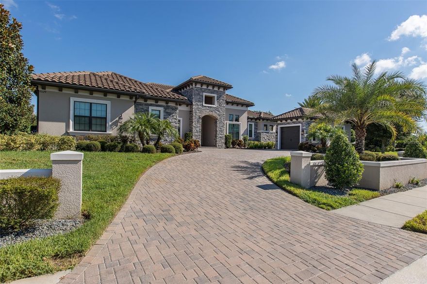 GOLF COURSE LIVING AT ITS FINEST! This MODEL PERFECT Champions Club home is Perfectly Situated with Views of Lush Golf Course, Water Views & Views of Fox Hollow & Champions Club Clubhouses! This Arthur Rutenberg Home is Absolutely Breathtaking! The Circular Driveway Welcomes you into this Custom Built Home! The Grand Foyer Offers Soaring Ceilings & Designer Tile Inlay & Custom Chandelier! Gorgeous Hardwood Flooring Flows Throughout this Open Floor Plan! The Great Room Offers Fabulous Views of Resort Style POOL & Golf Course and Boasts Solid Wood Beams, Gas Fireplace with Custom Stack Stone Wall & Pocket Sliding Glass Doors that lead you to Private Lanai! The Kitchen is a Chef's Delight Accented with Huge Quartz Island, Cabinets with Glass Custom Cabinets to Ceiling & GE Monogram Appliances! The Owner's Suite Offers a Double Door Entrance, His/Her Closets & Separate Sitting Area. The En Suite Bath is Pampering with Large Custom Shower, His/Hers Vanities & Relaxing GardenTub! The Secondary Bedrooms All Offer En Suite Bathrooms, Tray Ceilings & Roomy Closets. The Study is Spacious and Boasts a Wall of Custom Cabinetry Equipped with Elegant Quartz Counters! The Sprawling Bonus Room is the Perfect Space to Entertain Your Guests w/Wet Bar Area & Views of POOL! The Resort Style Custom POOL Looks Like it is Out of a Magazine with Custom Sun Shelf, Many Sprays & Picturesque Views! A Separate Casita Completes this Amazing Home and Features Spacious Room w/Closet, En Suite Bath & Kitchenette! All of this Can be Found on ONE OF THE BEST LOTS in All Of Champions Club! Champions Club is a Premier Golf Course Community, Conveniently Located Close to Many Shops, Restaurants, Medical Facilities, Short Drive to Many Local Beaches, Short Drive to Tampa International Airport, Clearwater/St. Pete Airport & Much More! Zoned for Excellent Trinity Schools! No CDD Fees & Very Unique Golf Course Community! PERFECTION!