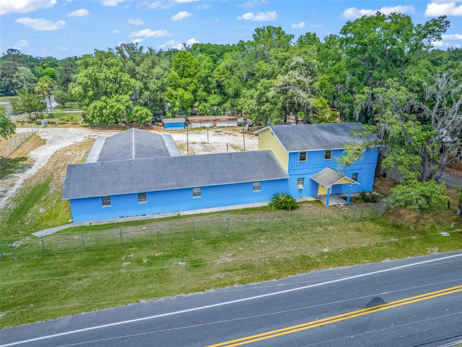 Price Improvement! Versatile 6,700+ Sq. Ft. Mixed-Use Building – Prime Location!
Endless possibilities await in this multi-purpose property offering over 6,700 sq. ft. of space with excellent visibility on a busy street. Conveniently located near US Hwy. 27, Hwy. 301, Hwy. 441, Hwy. 484, and I-75, this R-4 Mixed Residential-zoned building is ideal for residential, commercial, or institutional use.
The ground floor features a spacious 3-bed, 2-bath apartment, a fully equipped kitchen, a large workshop, multiple offices, a reception area, ample storage, and two public bathrooms. Upstairs, a private 3-bed, 1-bath apartment includes a great room and a bonus space perfect for a walk-in closet or kitchenette.
Outside, enjoy plentiful parking and flex space ready for customization. Formerly a Religious Center, permitted uses include single or two-family residences, professional offices, daycare, rehab center, public lodging, and more. Recent updates include a new roof (2015), HVAC upgrade, chain-link fence (2019), septic drain field (2021), and well pump (2021).
With a little TLC, this property can become a thriving hub of activity. Don’t miss this unique opportunity—schedule a tour today!