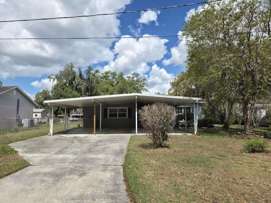 Bring your vision and make this charming 3-bedroom, 1-bathroom home your own! Nestled on a 0.22-acre lot in Richland Manor with no HOA, this property offers over 1,100 square feet of living space. Inside, you'll find a cozy living room that flows effortlessly into the dining area and connects to a galley-style kitchen. The spacious bedrooms are located toward the back of the home, providing a quiet retreat. A family room and bonus room add extra flexibility for entertaining, a home office, or additional living space. Enjoy the fully fenced backyard, perfect for pets, gatherings, or gardening, plus a large workshop and shed for added storage. Conveniently located near Highway 60 with quick access to shopping, dining, and everyday amenities.